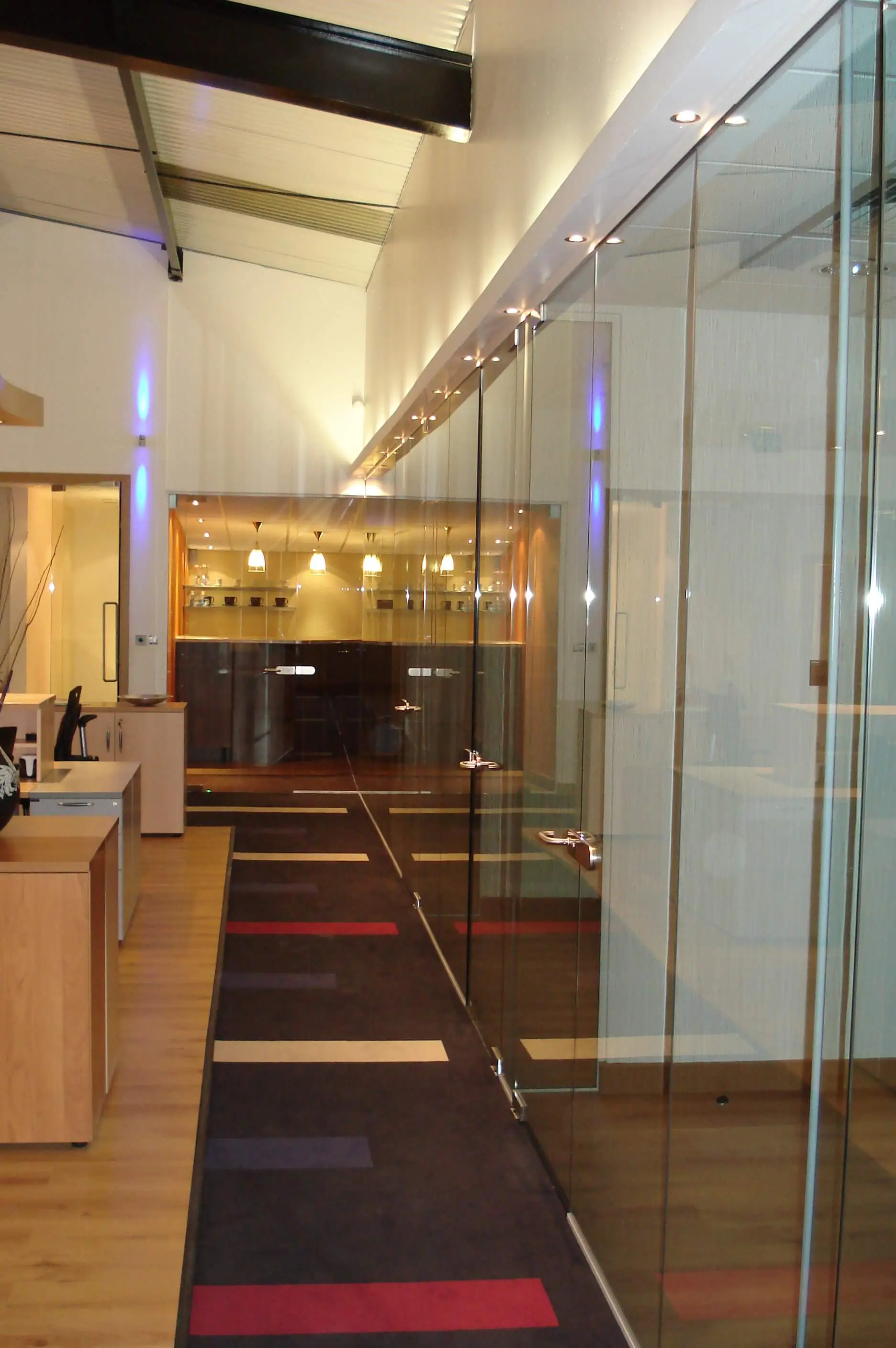 Carlise holdings office with glass partitions and lighting
