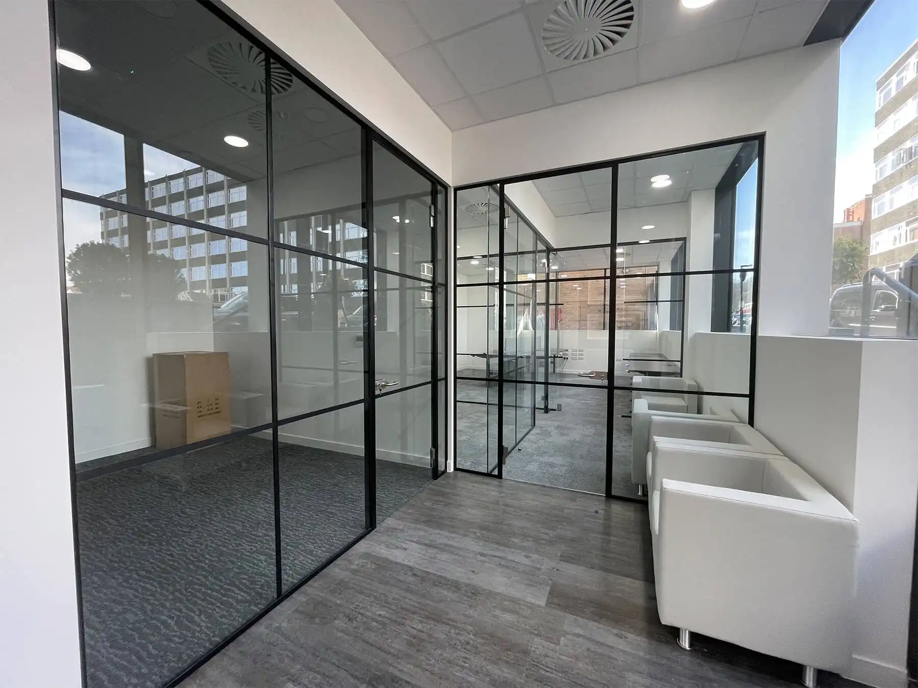 Carter Bond office space with Black framed glass partitions