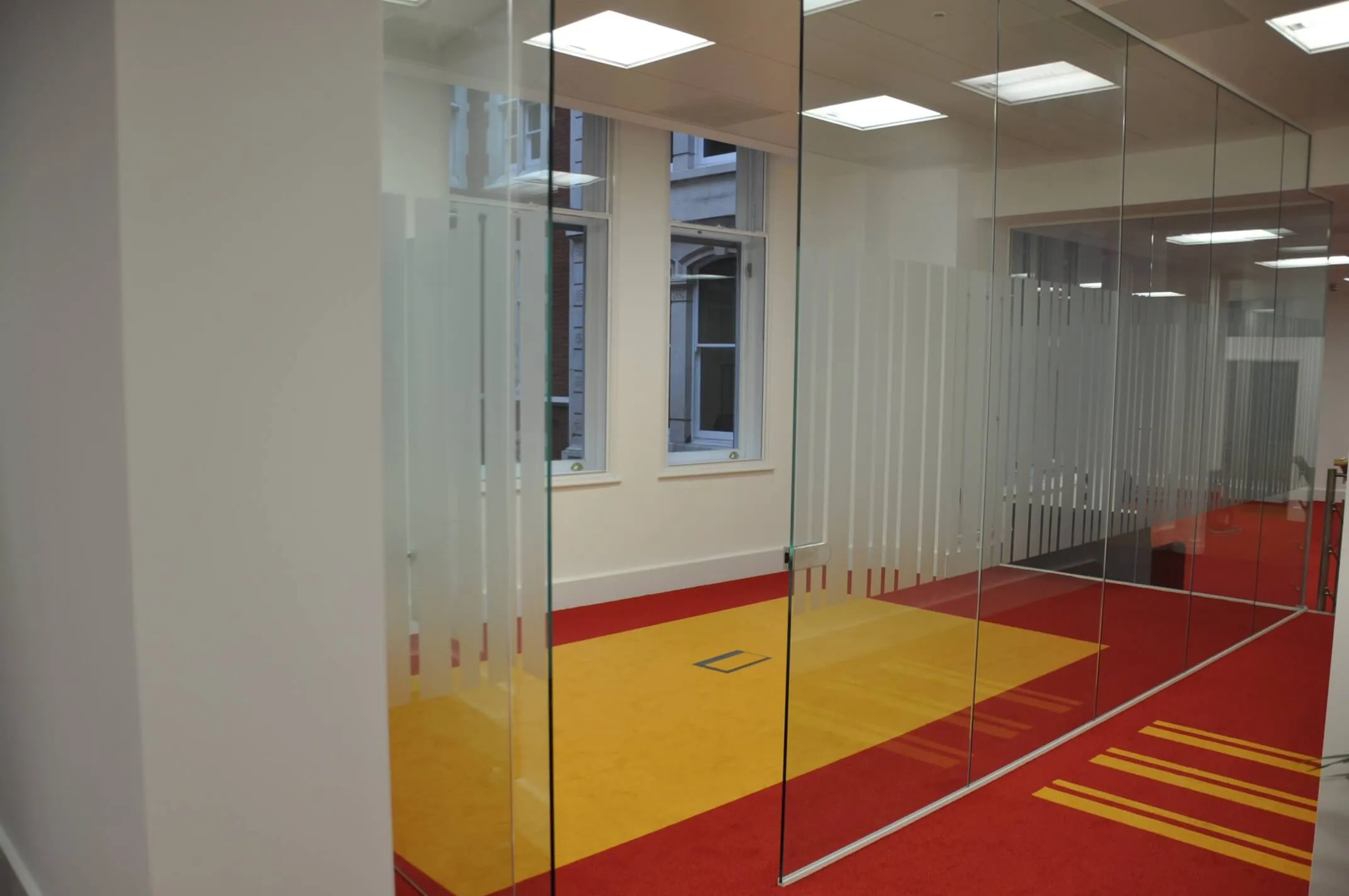 Designer floor and glass partition with designer manifestation in office