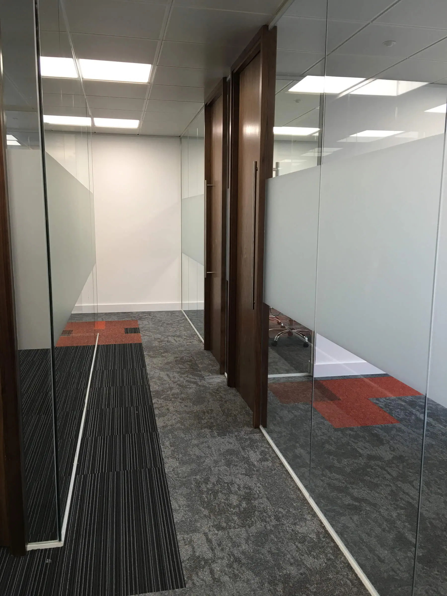 Designer floor and glass partitions in office