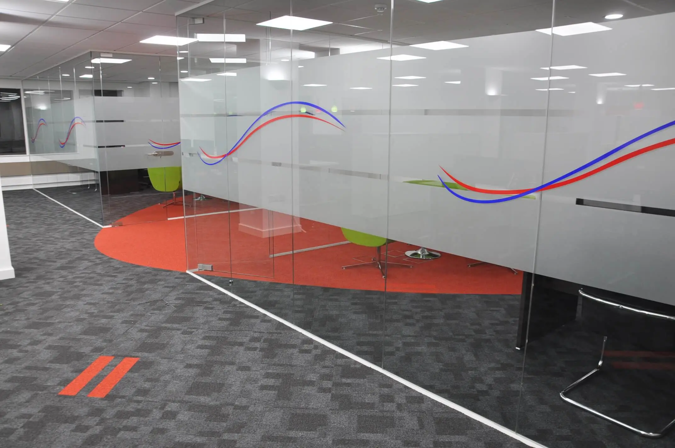 Designer flooring inside office space with glass partitions