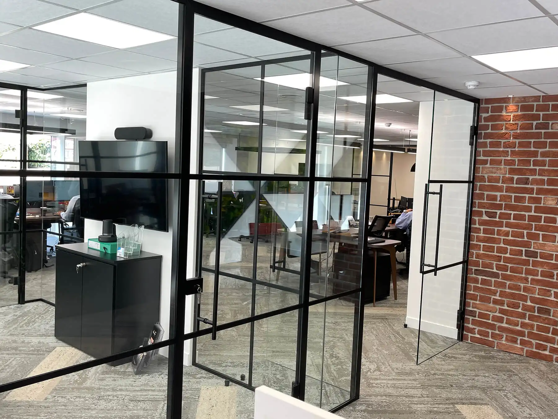 Designer wall furniture and and glass partitions in office