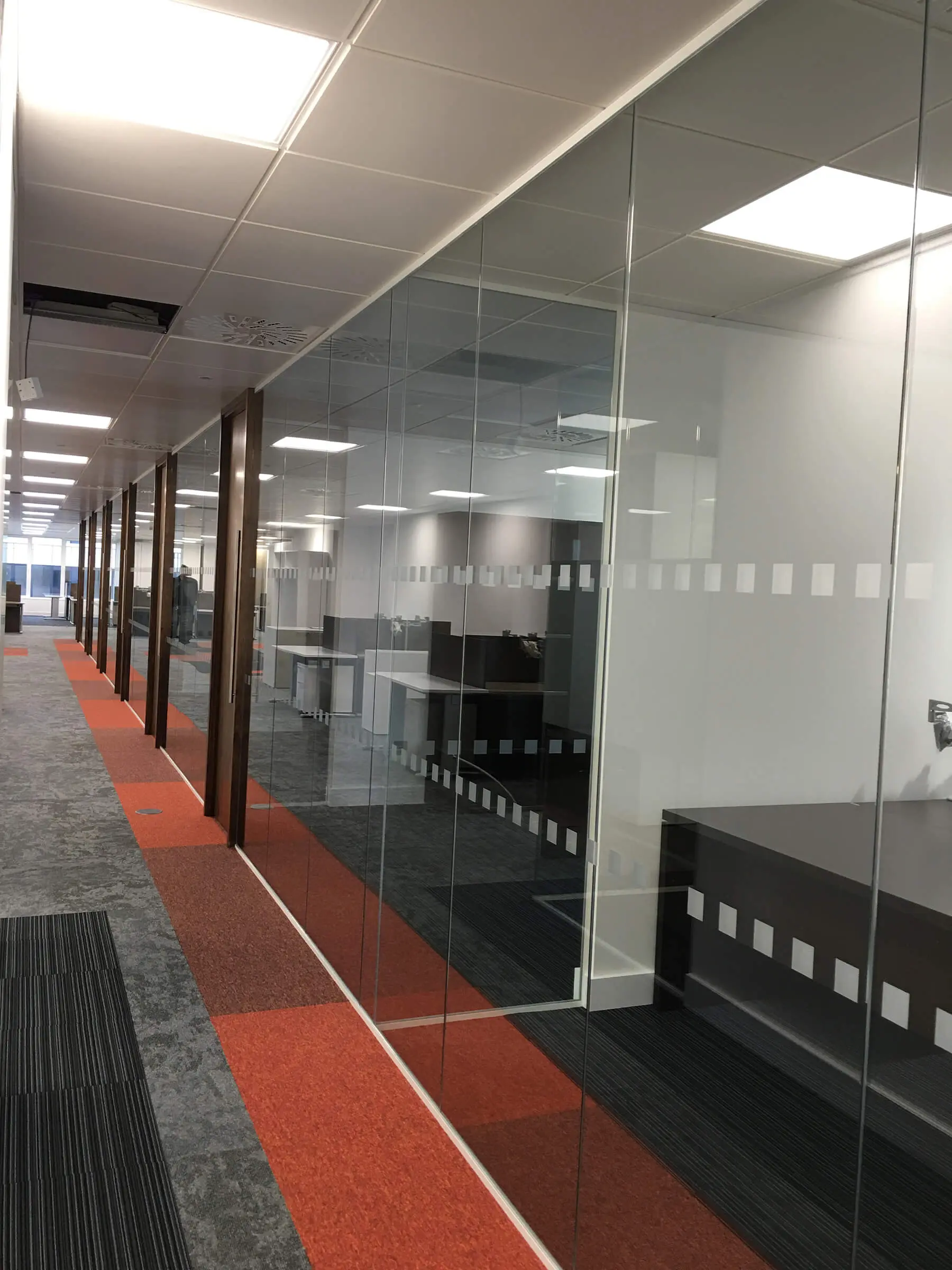 Dotted manifestation glass walls with wood doors