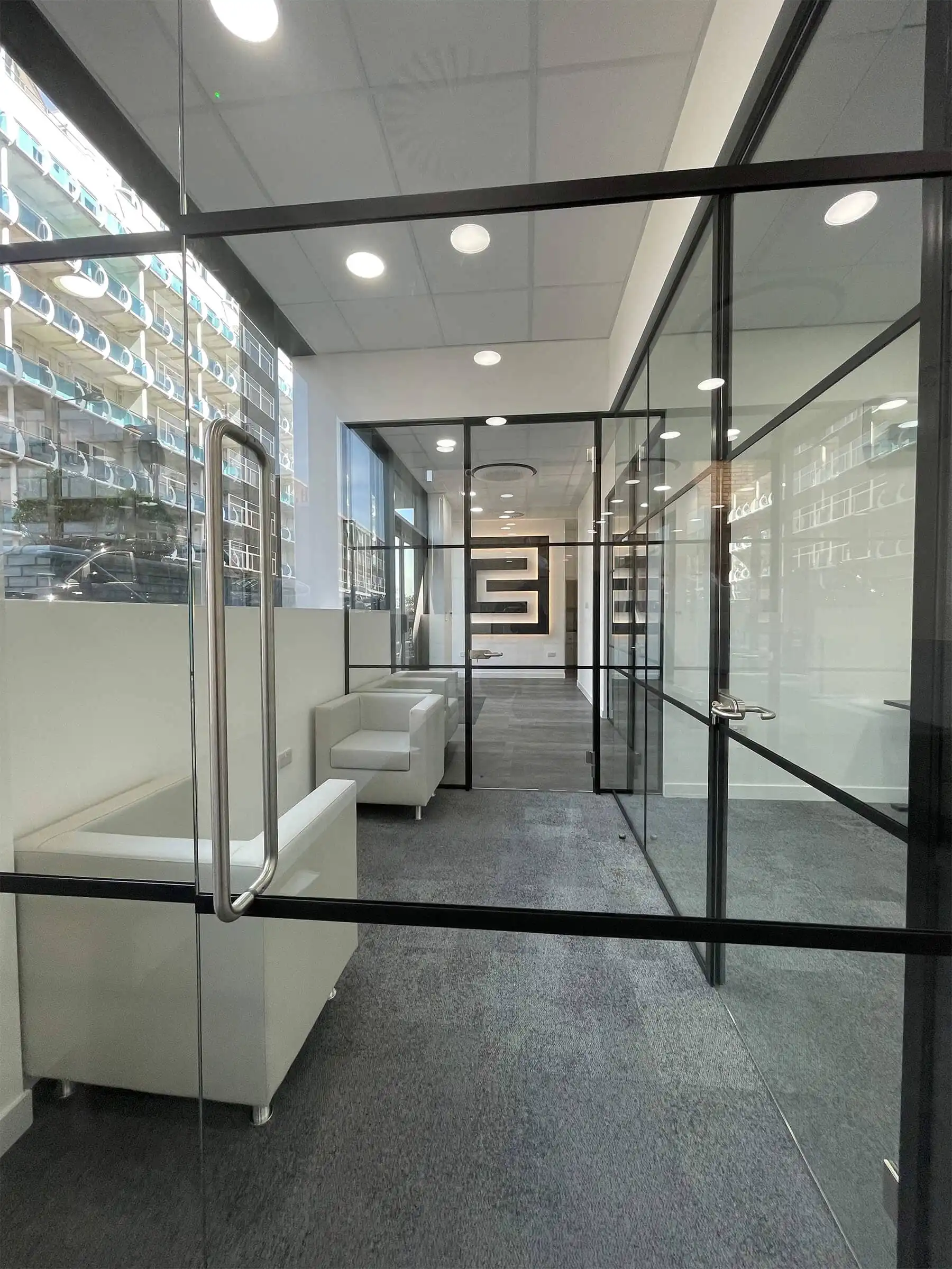 Framed glass walls and doors in office