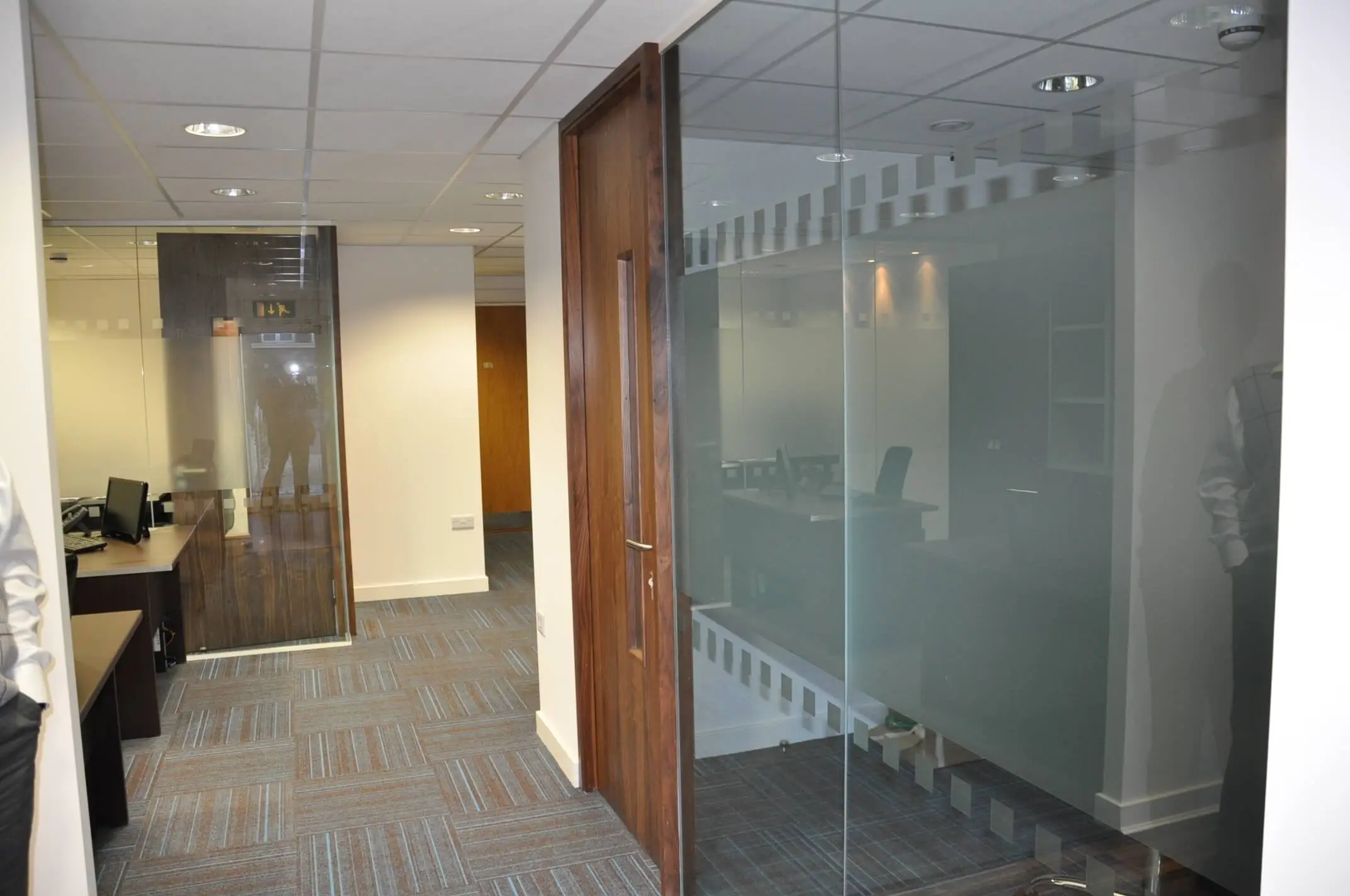 Glass manifestation with solid wood door in the office rooms