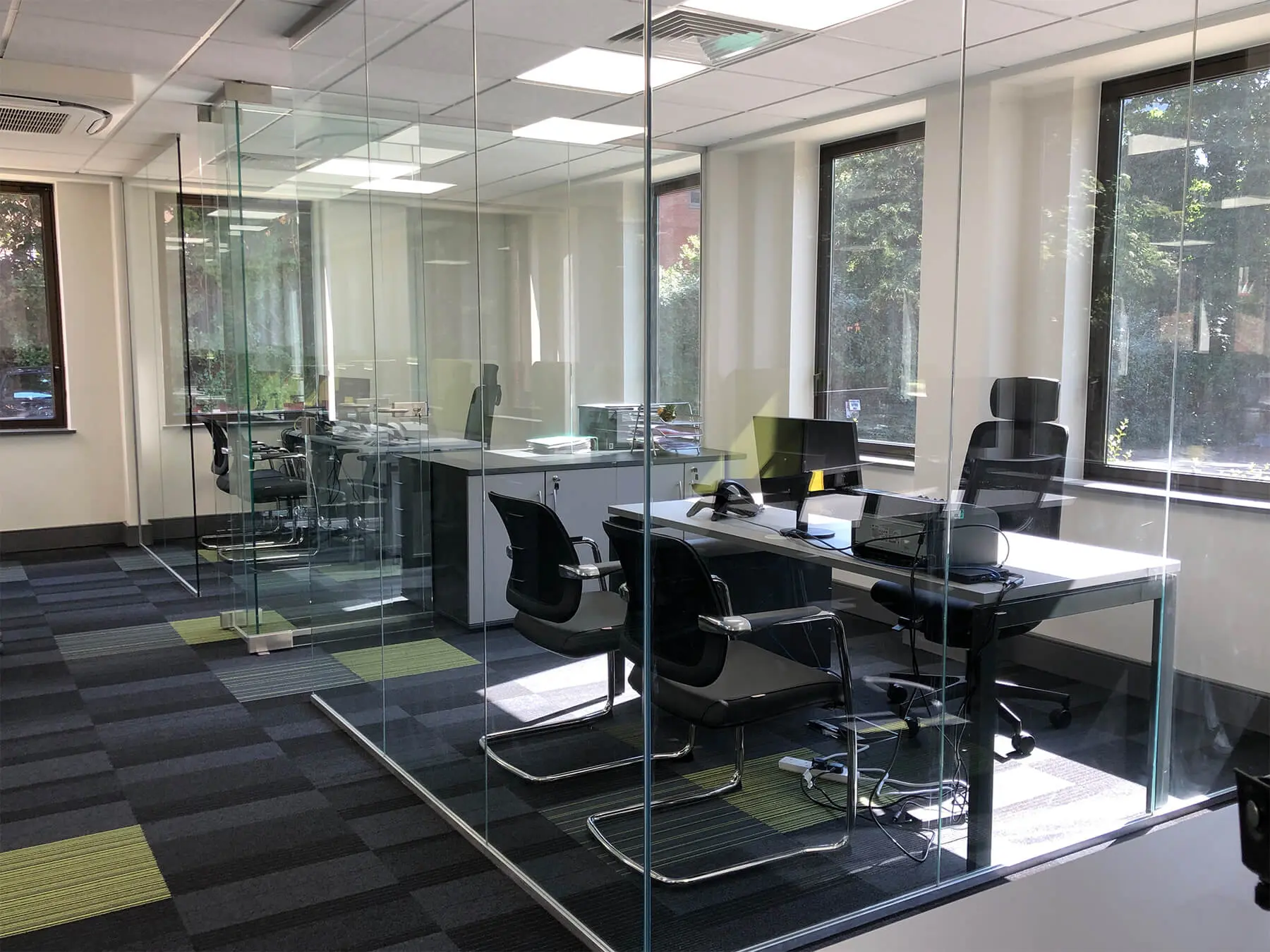 Glass partitioned work space with designer floors