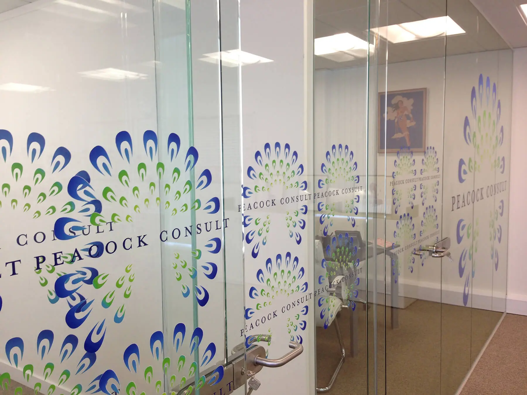 Glass partitions with glass doors and logo cut outs