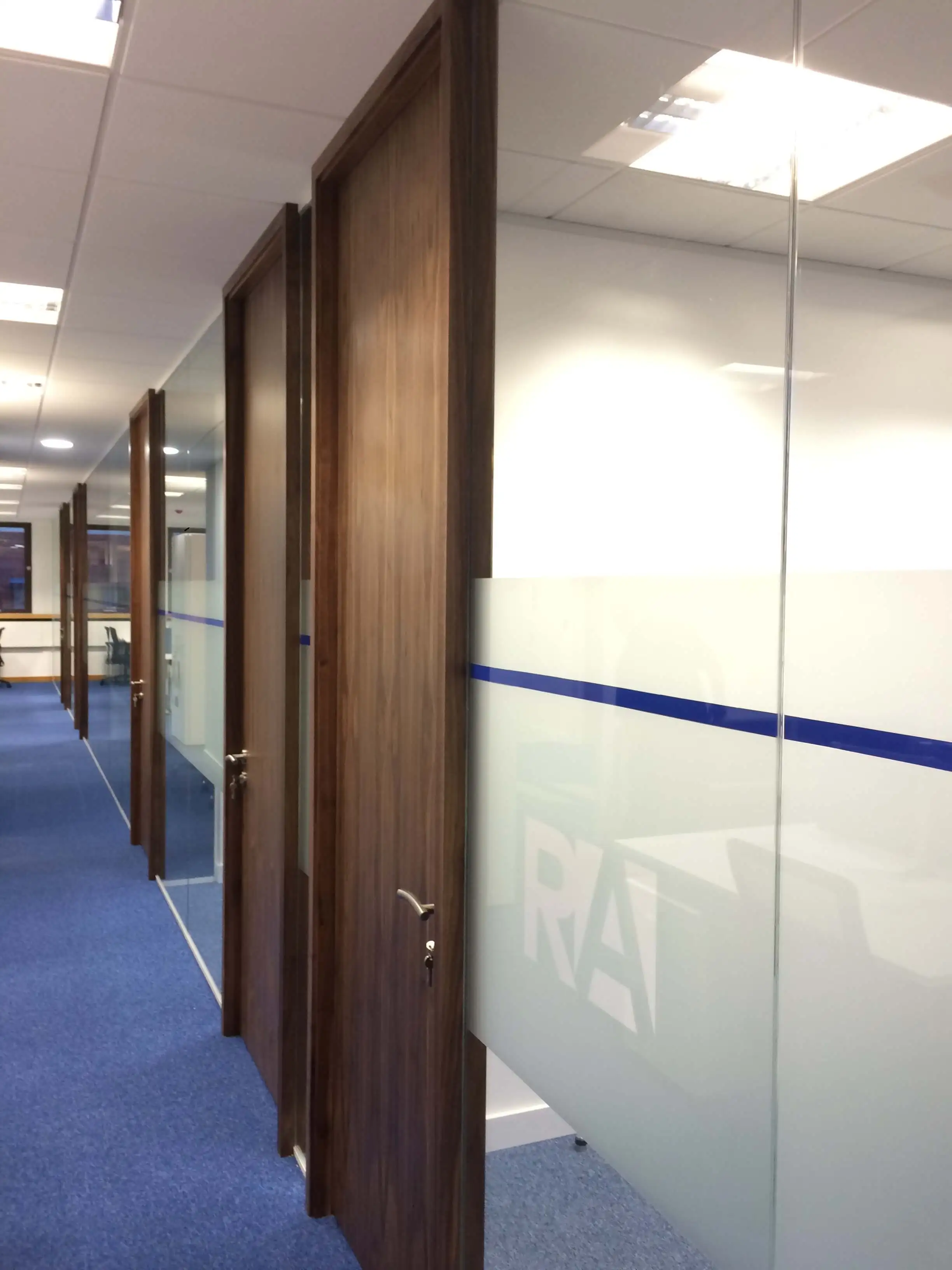 Glass partitions with solid manifestation and solid wood and designer floor