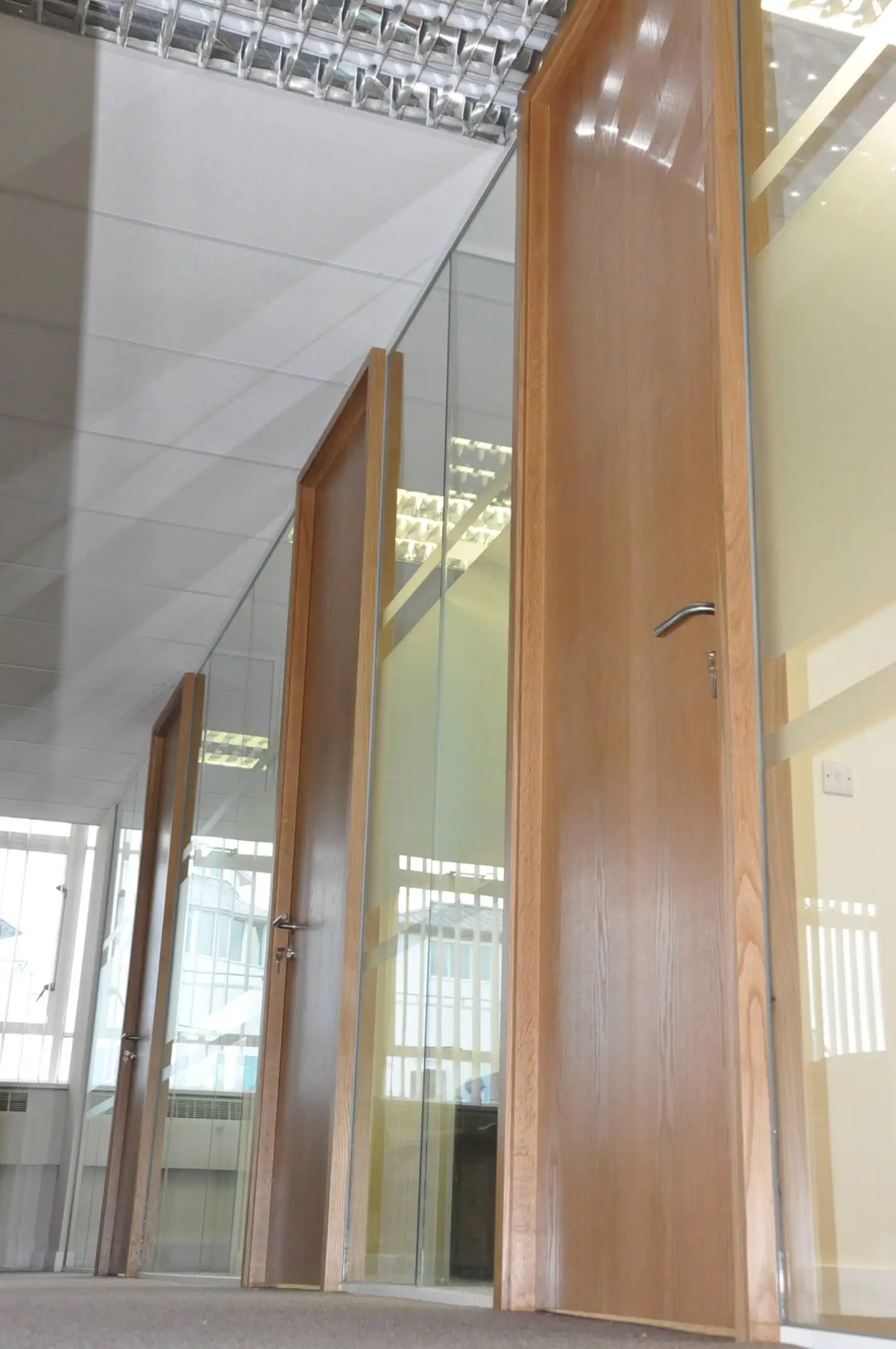 High glass partitions with high solid doors