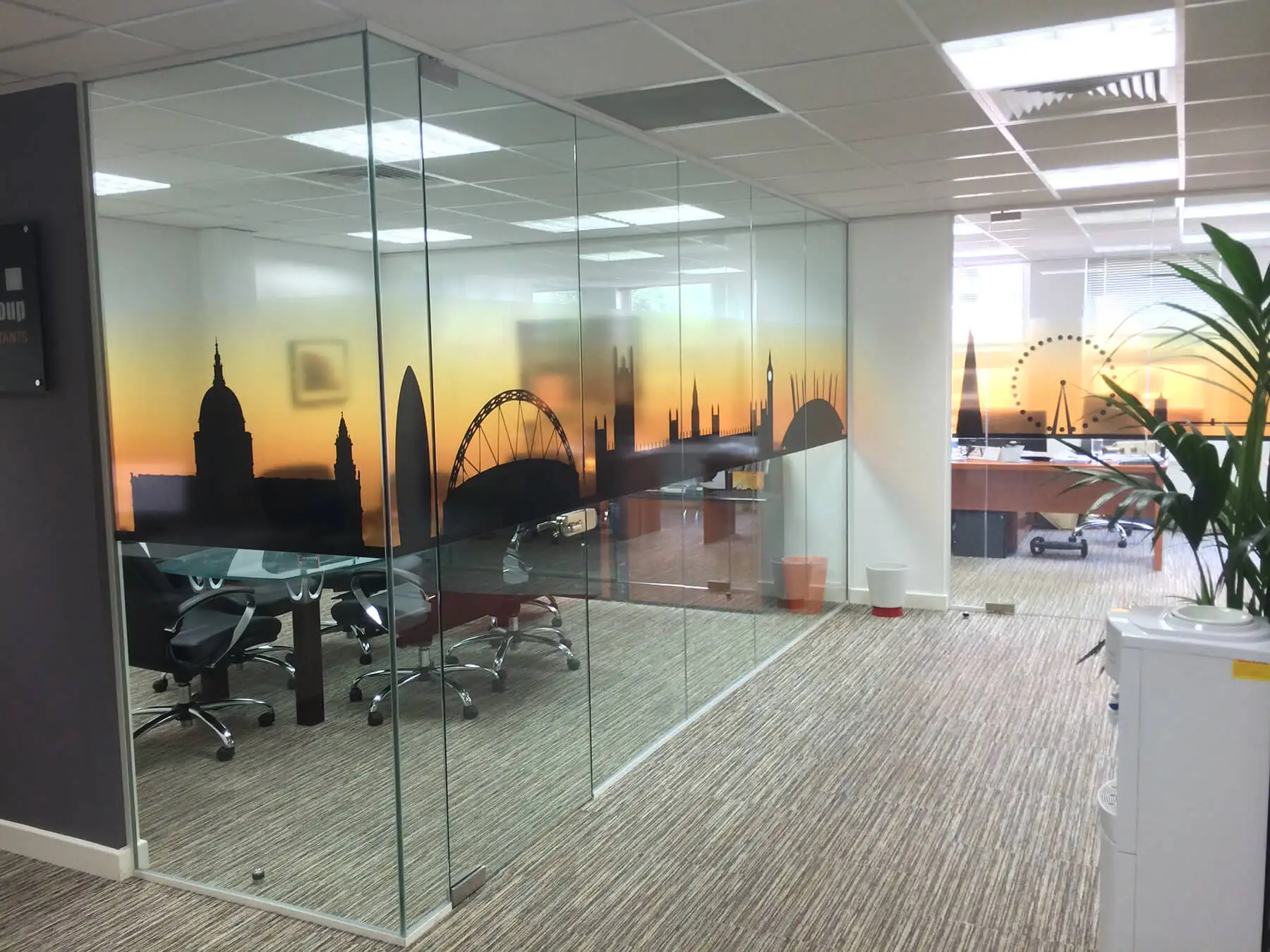 Large office space divided with desinger glass parttions and with flooring