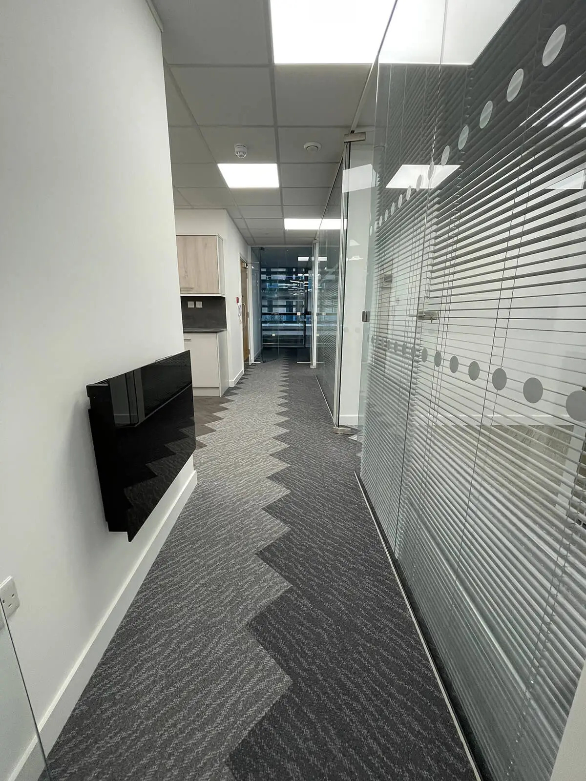 Large office space with designer floor glass partitions and TV