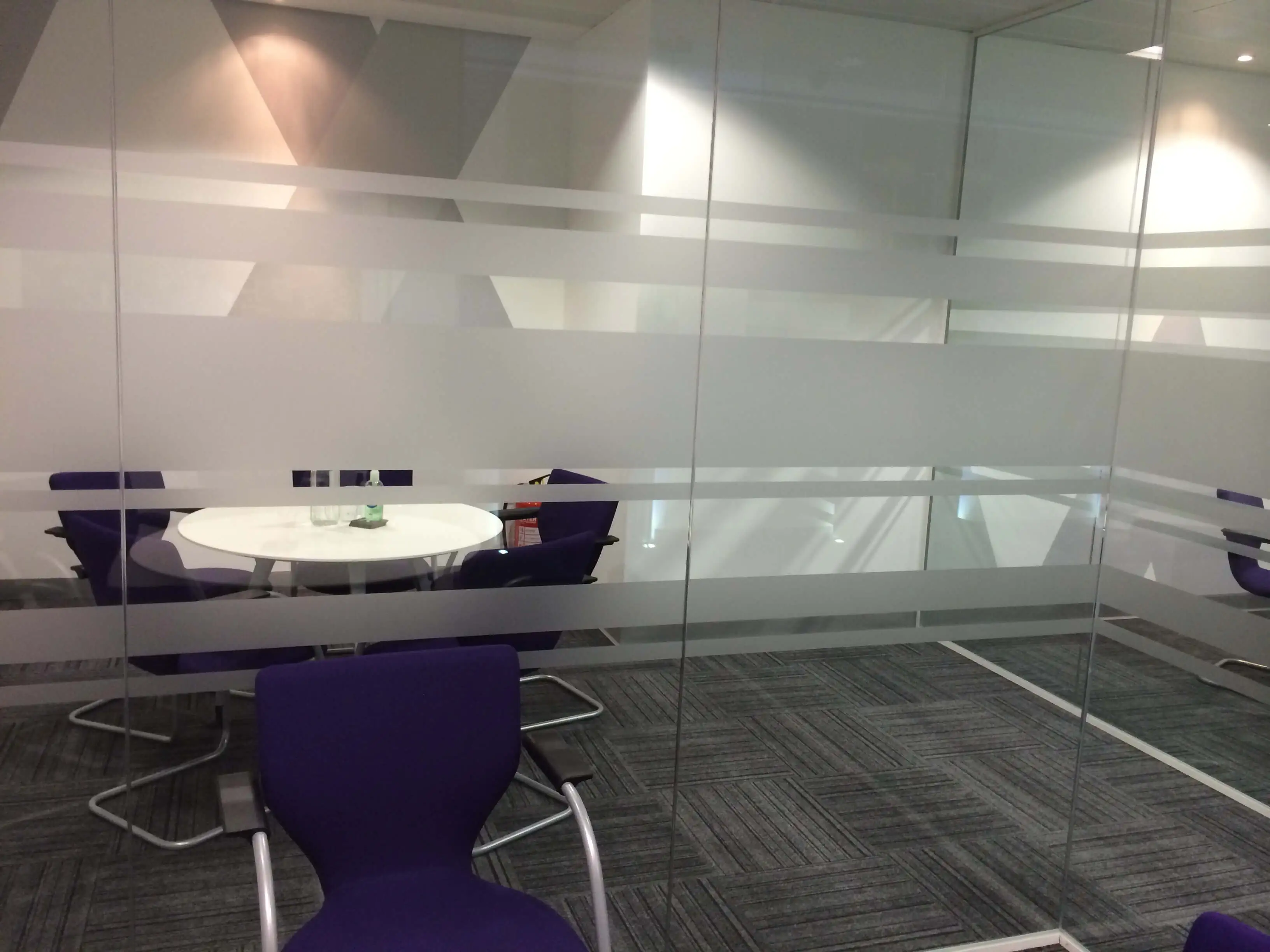 Manifestation on glass partitions of meeting room