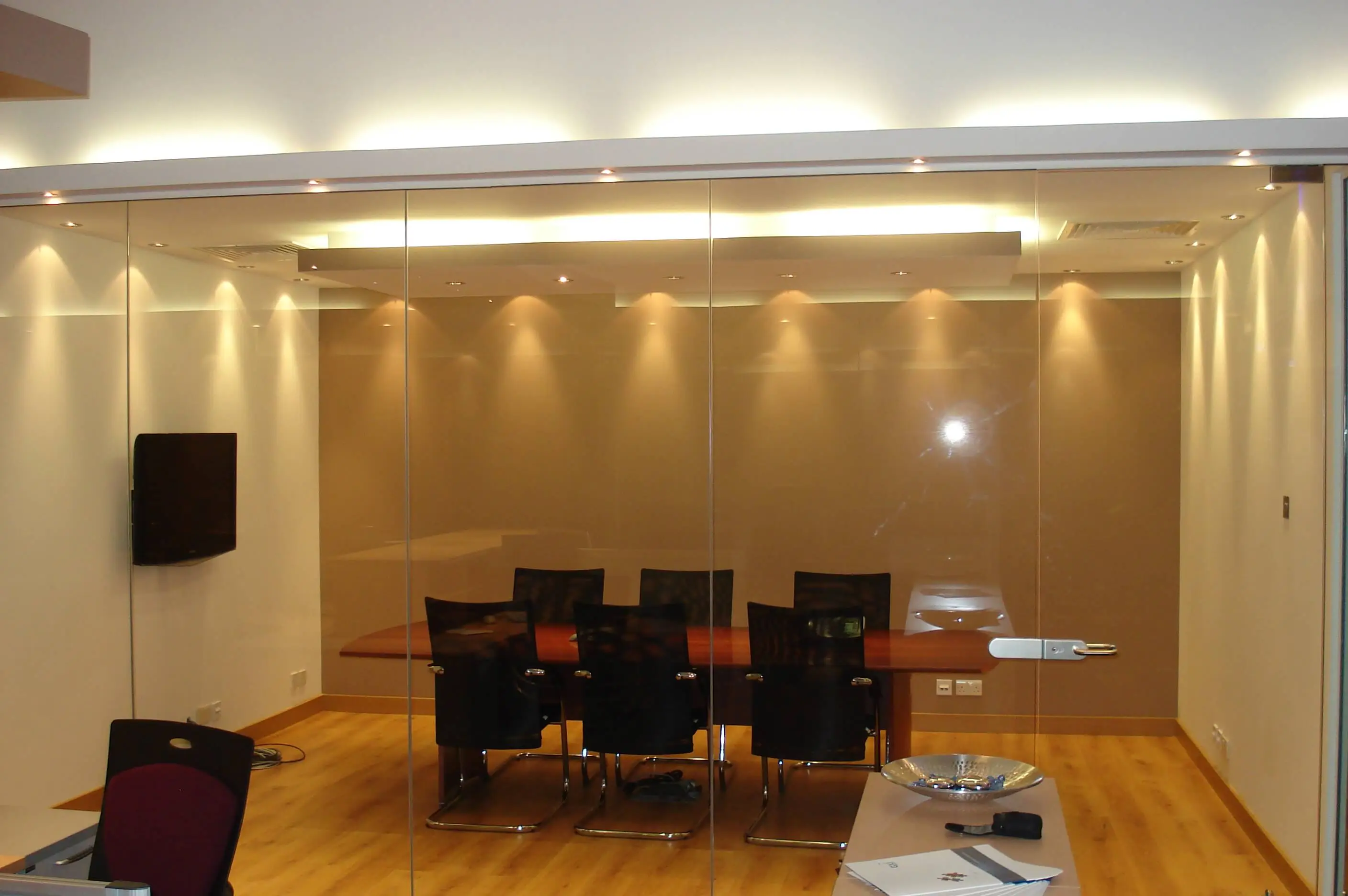 Meeting area with glass partitions and lighting