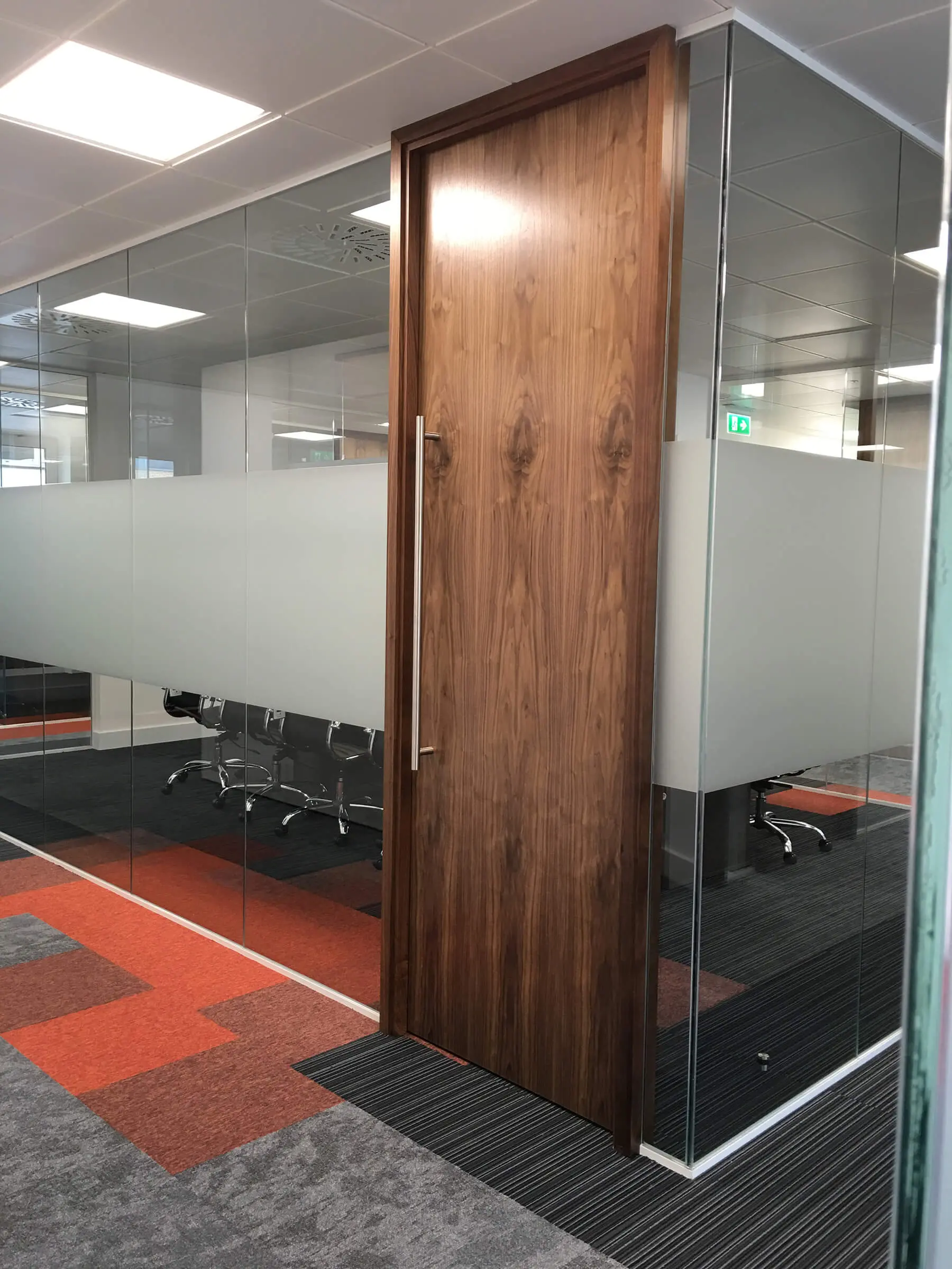 Meeting area with wood doors and glass partition