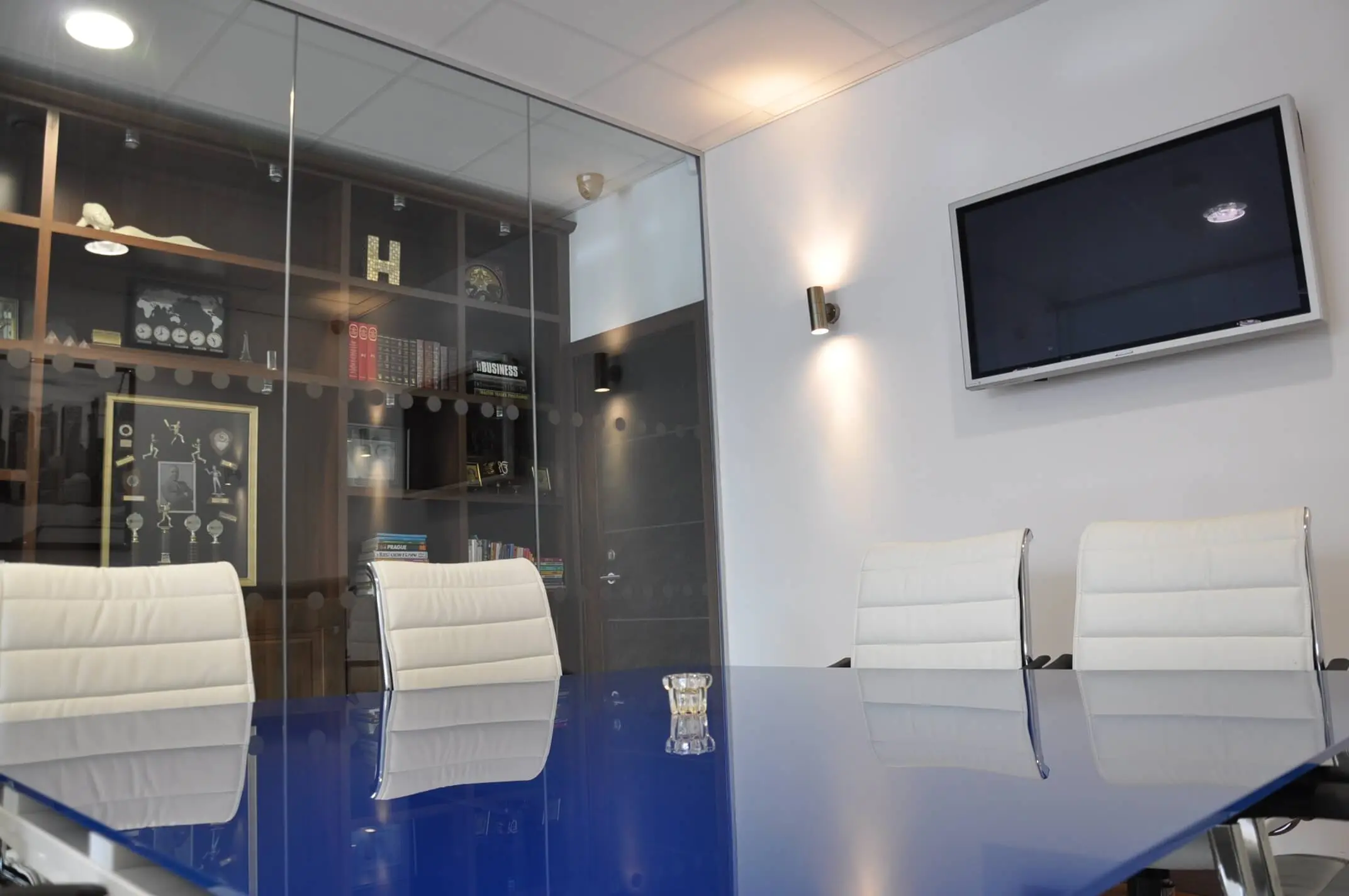 Meeting room with table, chairs, TV, Storage and glass walls