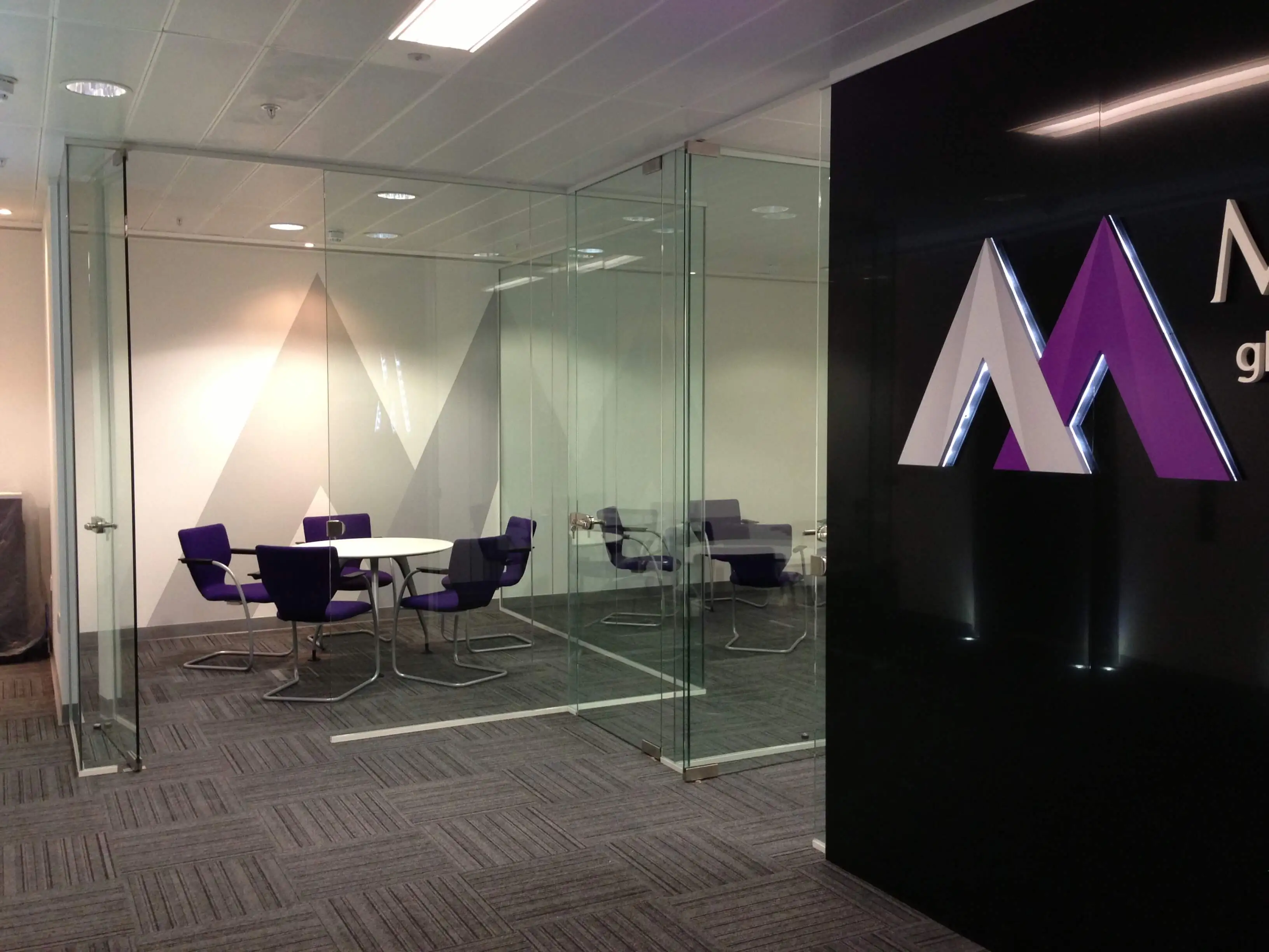 Montash office with frameless glass partitions