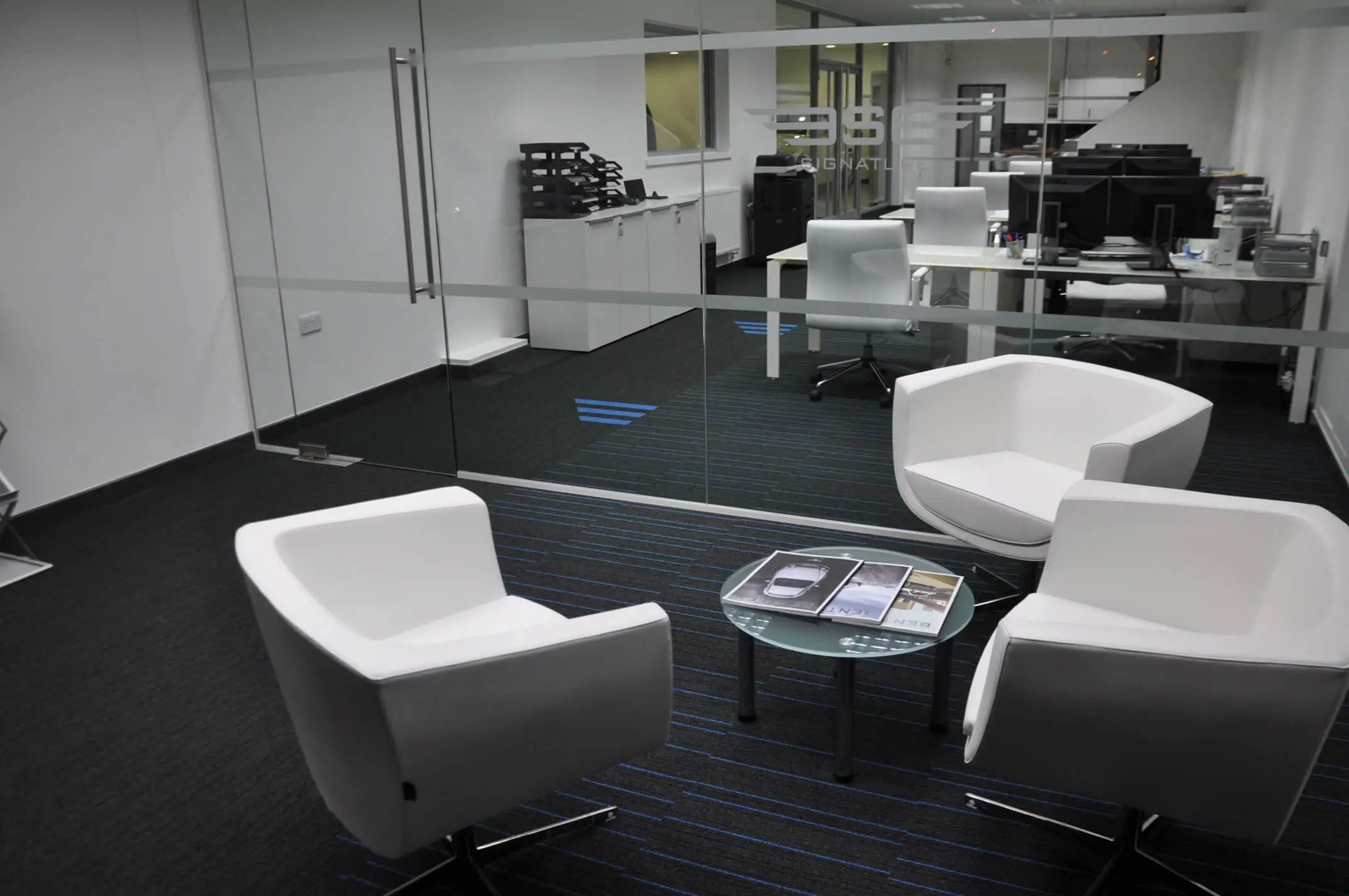 Office Breakout space with single glazed glass partitions