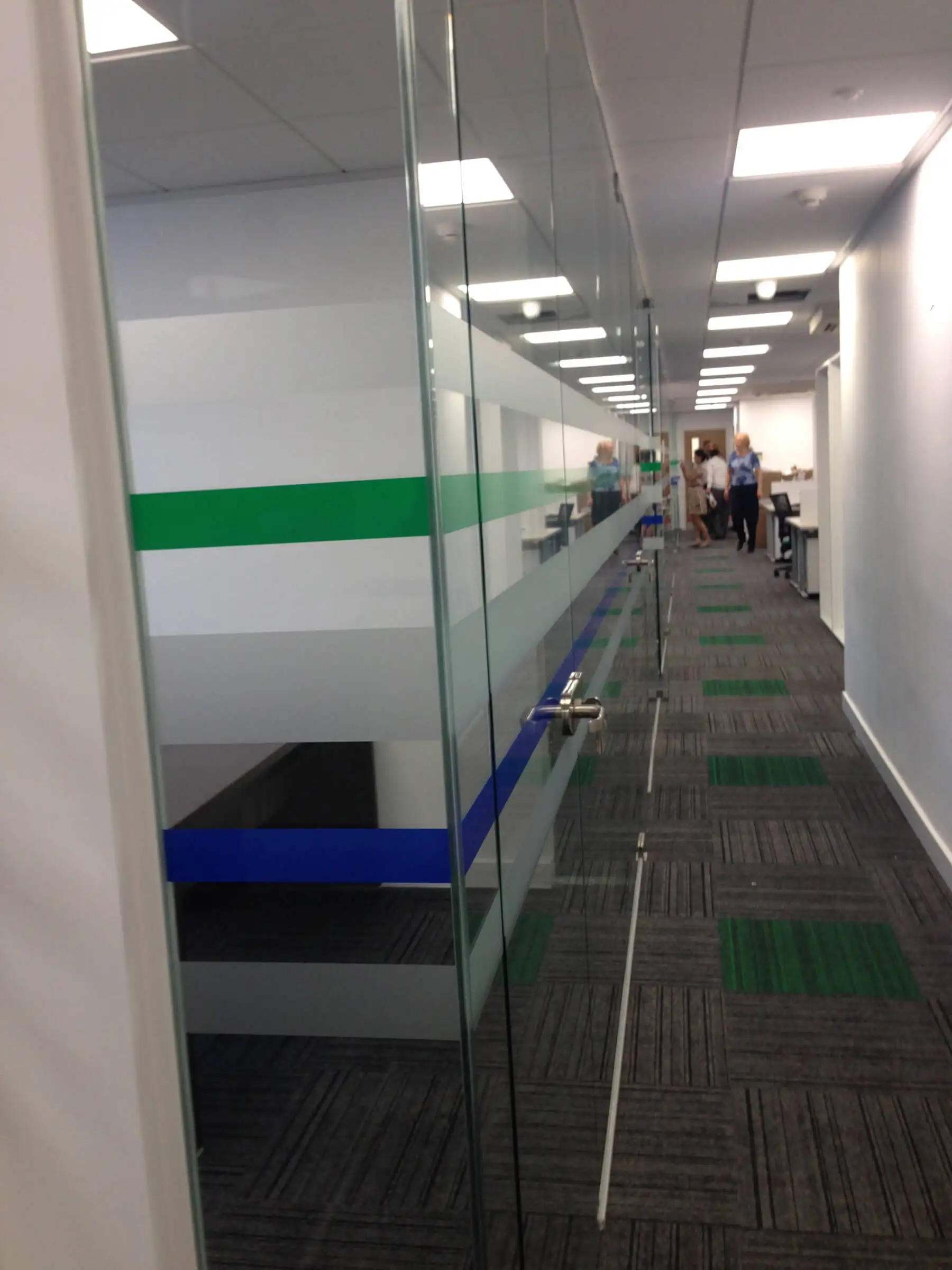 Office area along with designer frameless glass partitions floor and furniture