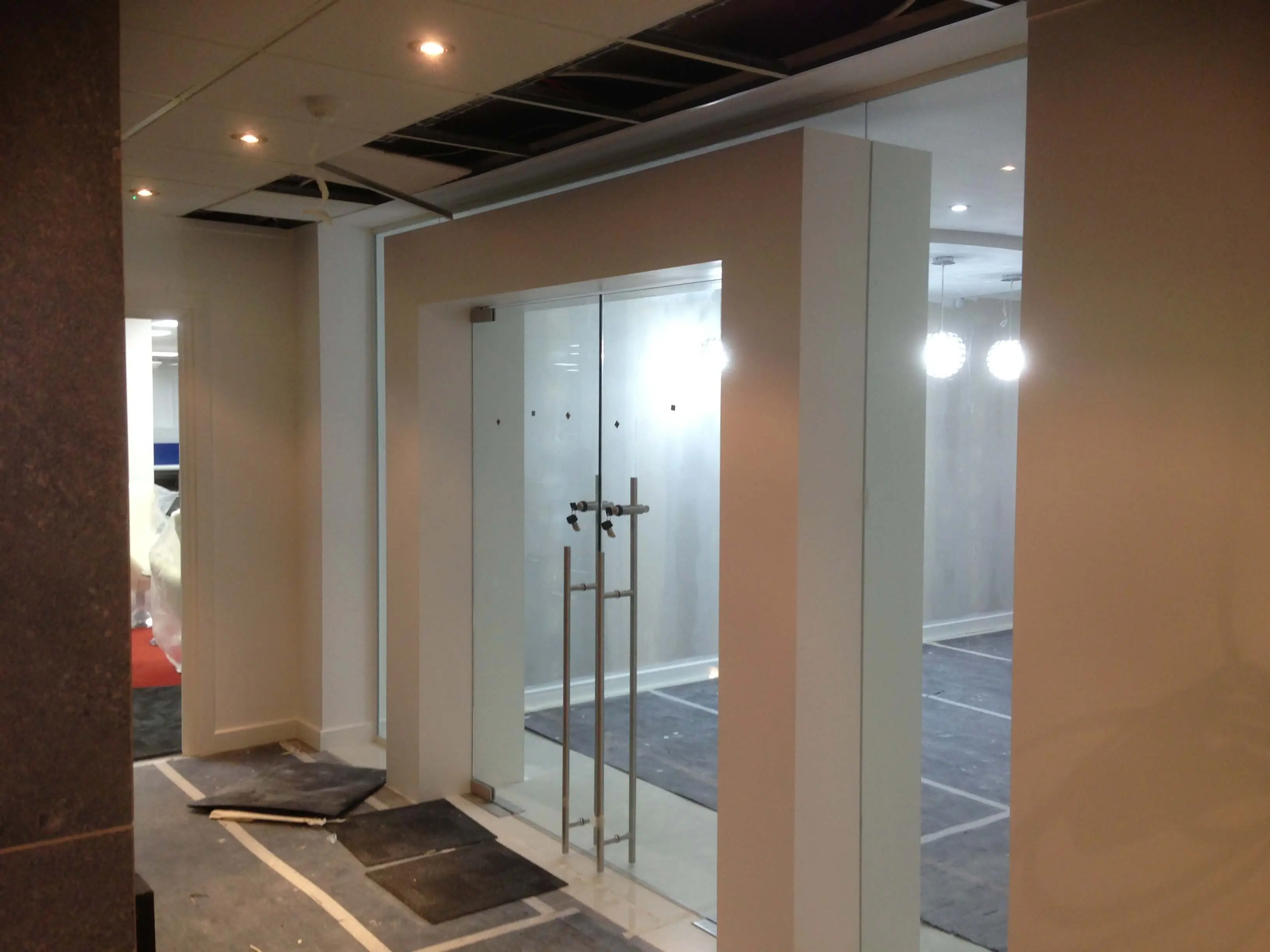 Office area with glass doors with full height handles