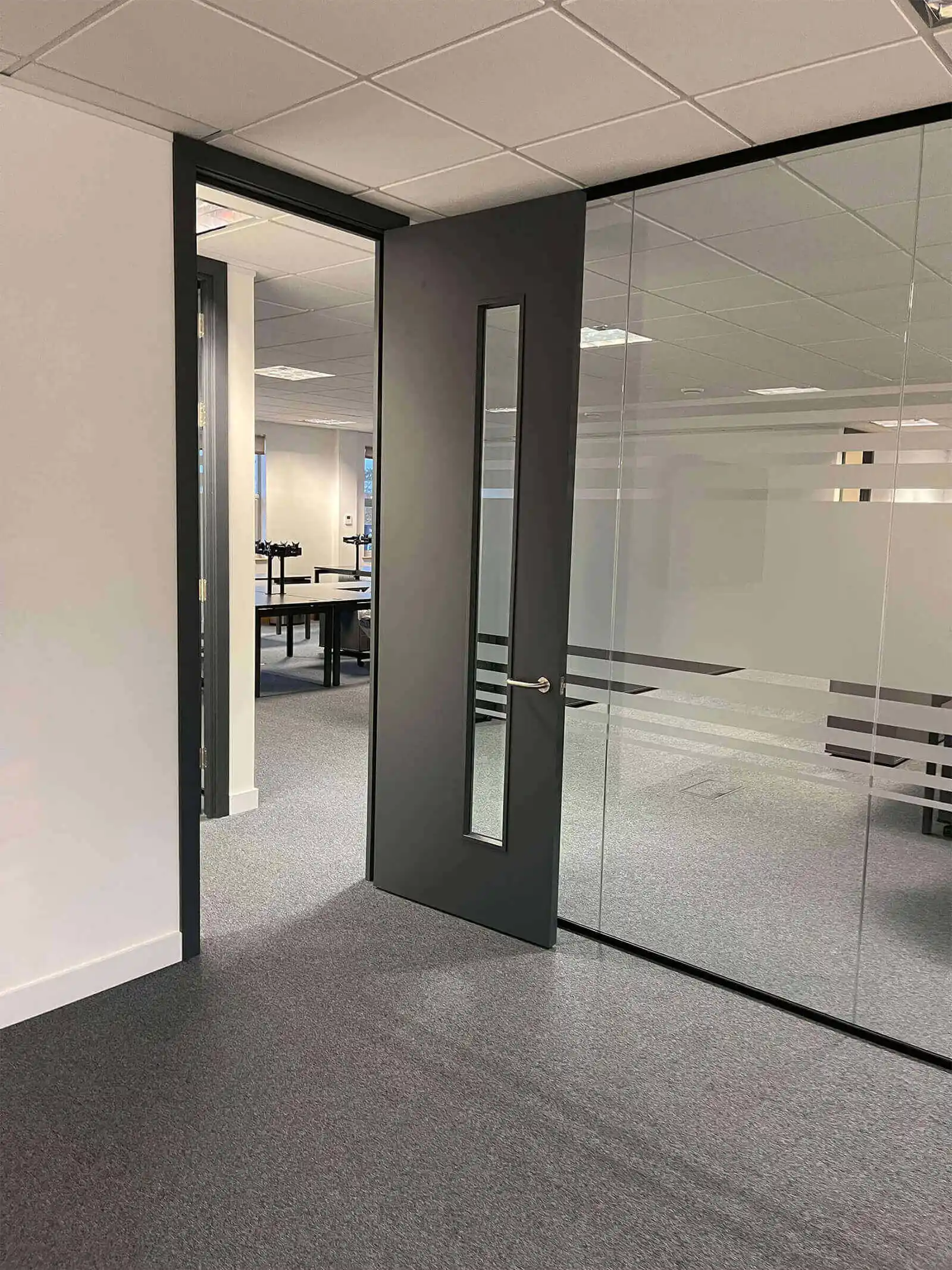 Office glass partition with solid door