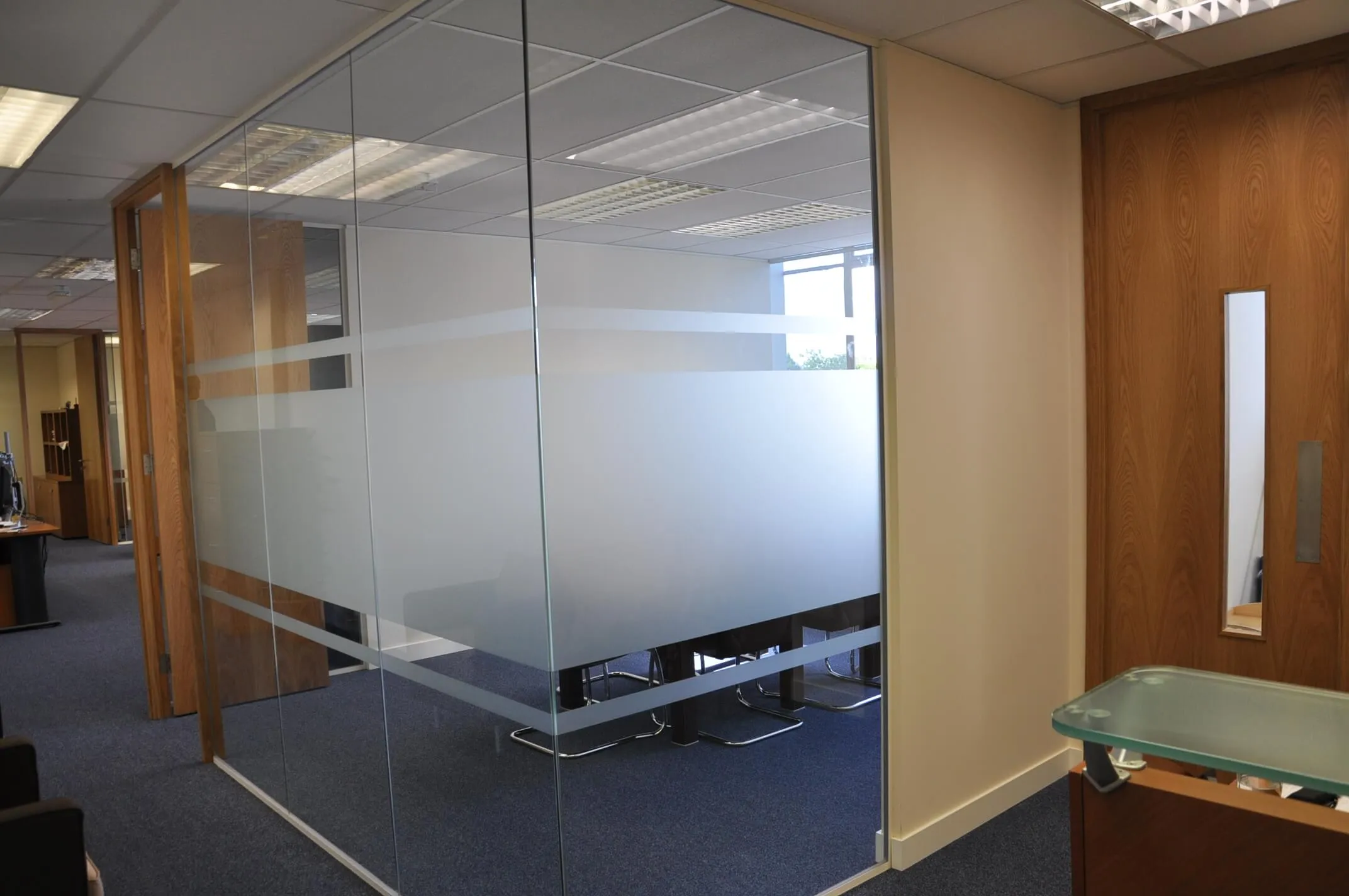 Office meeting area space with glass partitions with manifestation