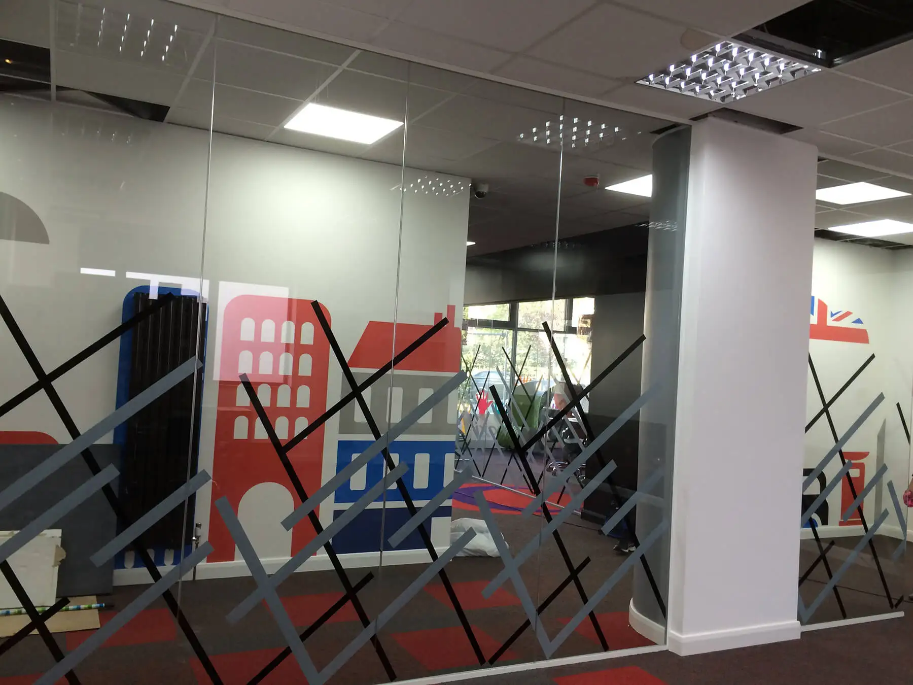 Office space partitioning with designer glass walls