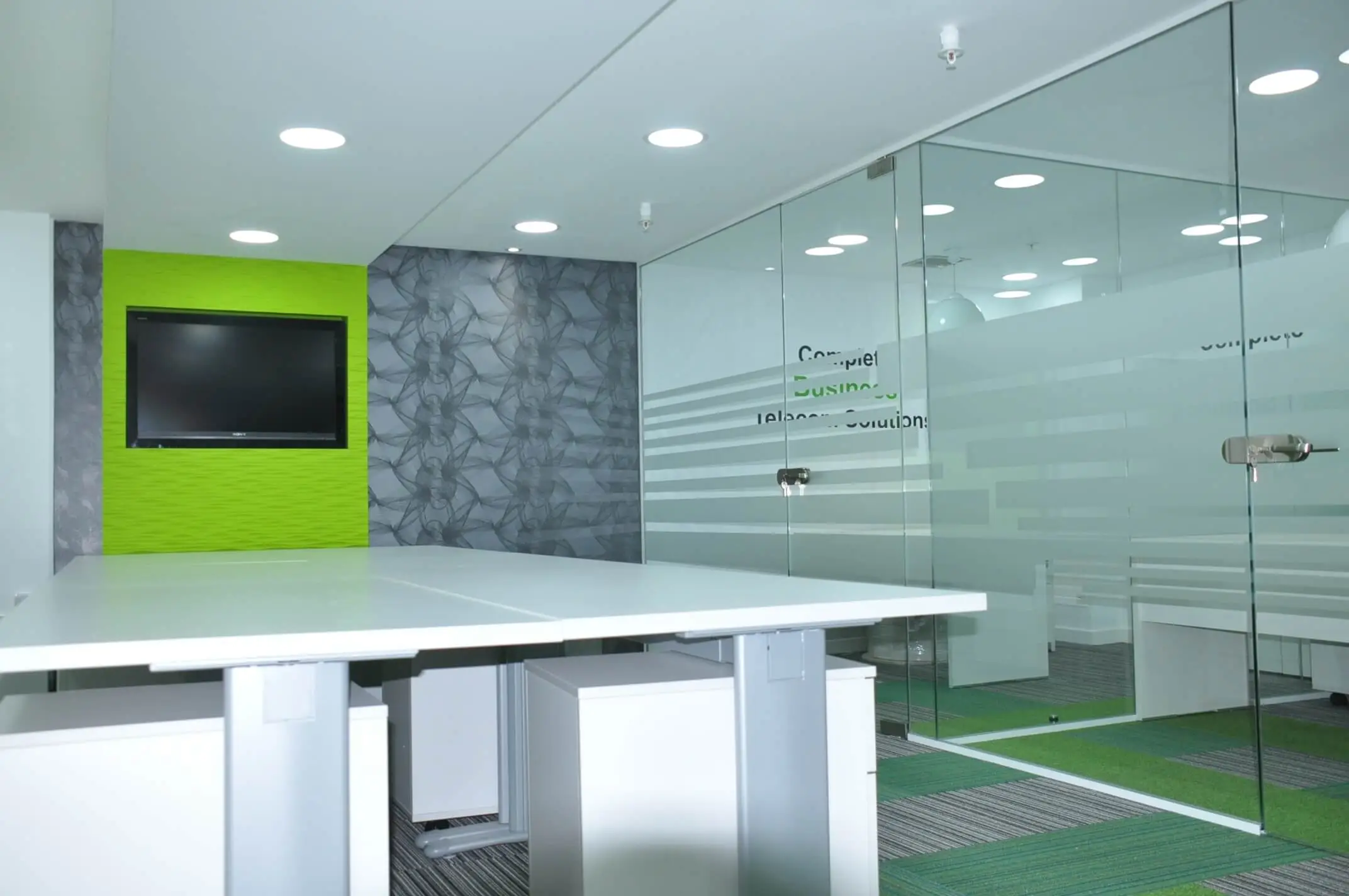 Office space with TV desk and glass partition