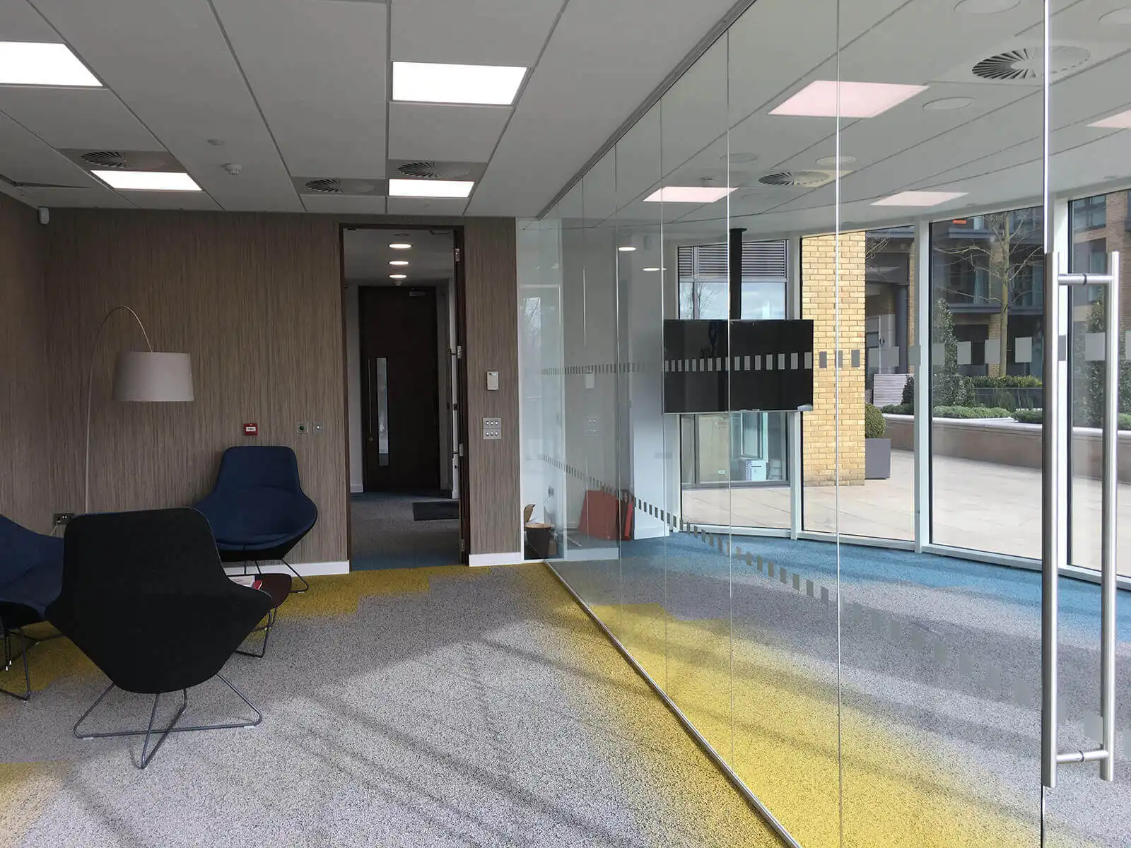 Office space with brakout space and structural glass partition