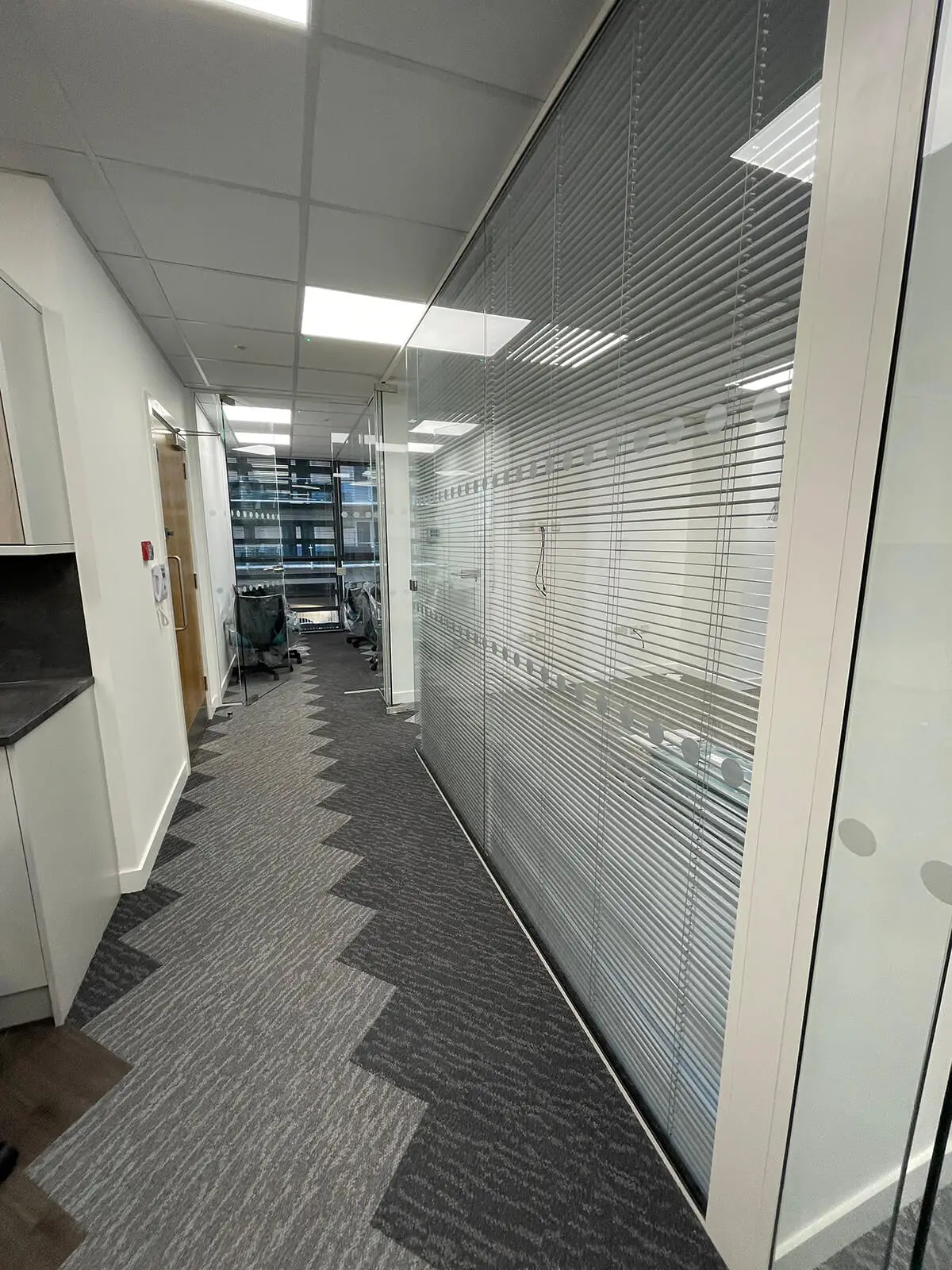 Office space with designer flooring and glass partitioning