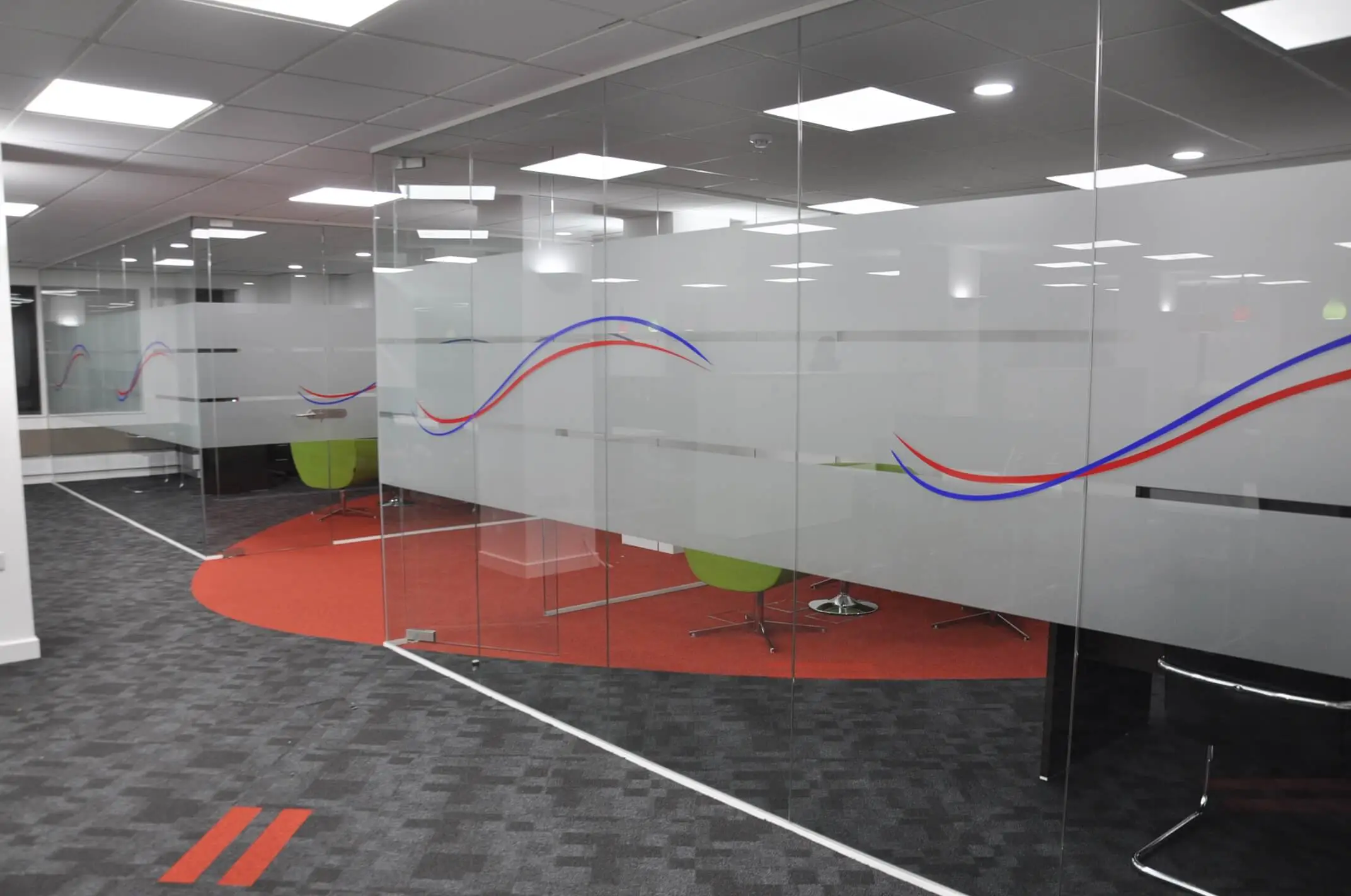 Office space with designer glass walls and flooring