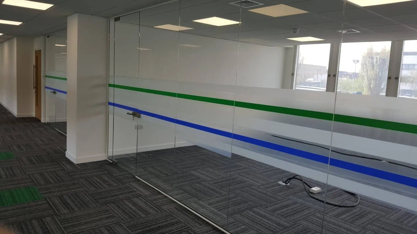 Office space with glass partitions with manifestation and glass windows