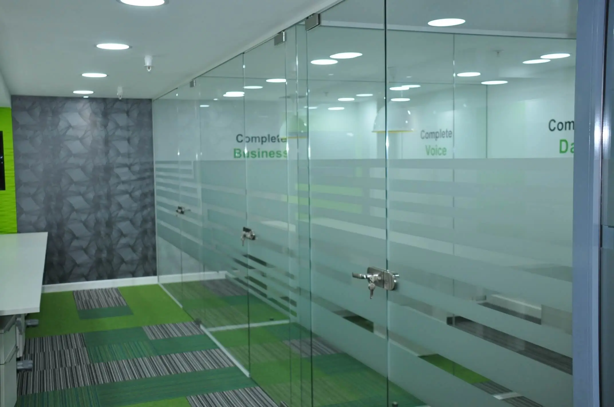Office with single glazed glass partition designer floor and lighting