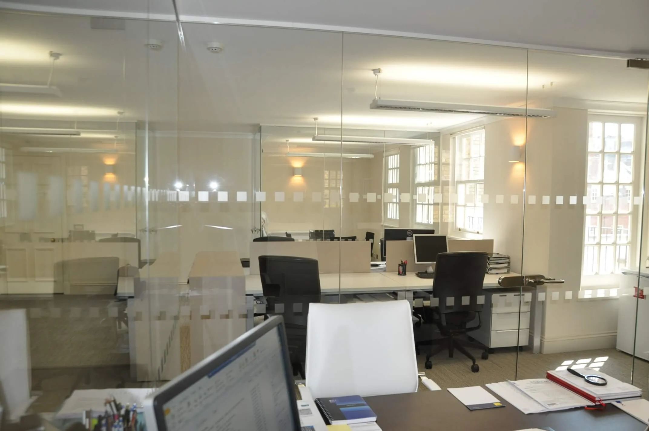 Office work and private area divided with glass walls
