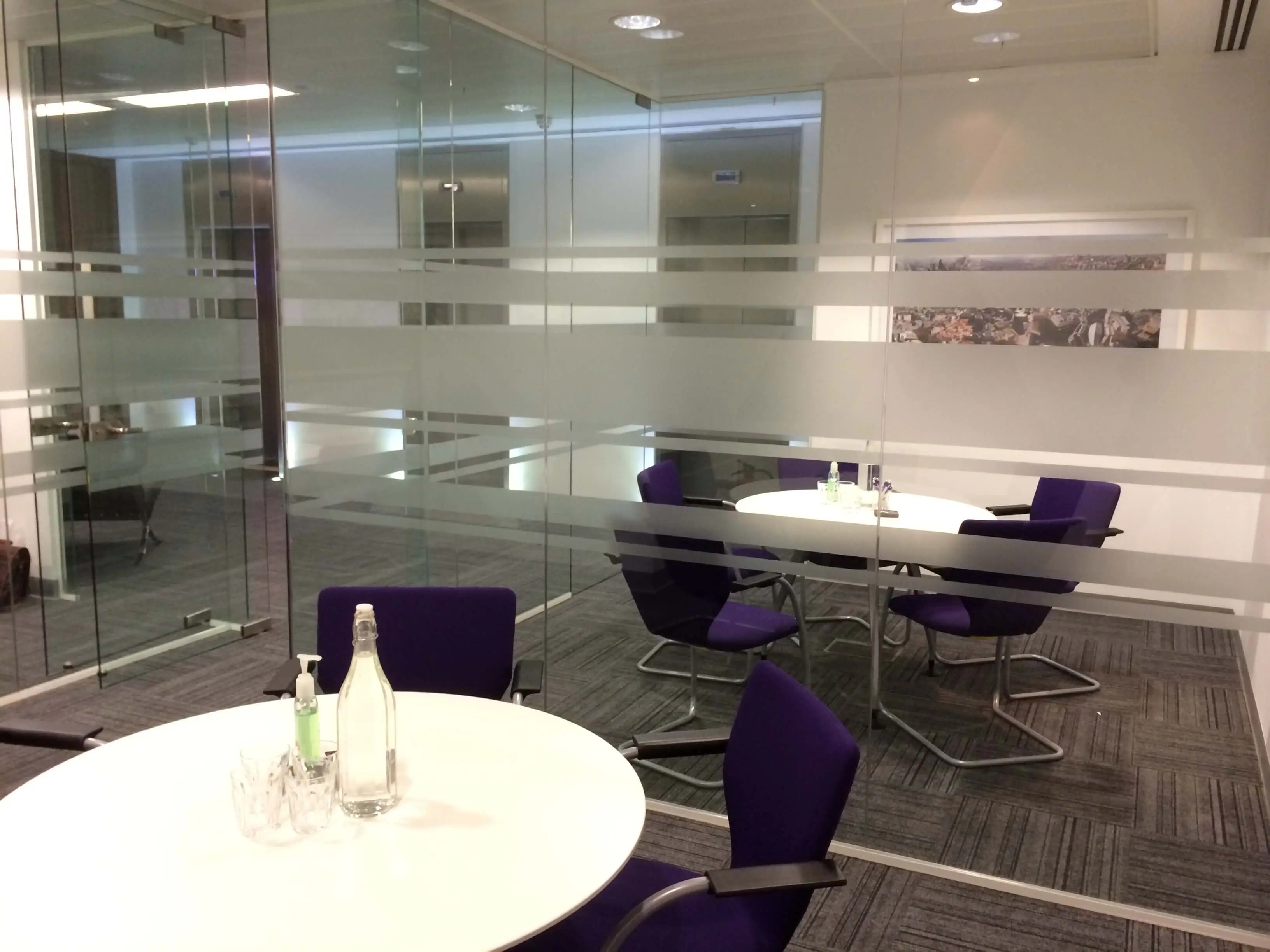 Two small meeting rooms are separated with glass walls