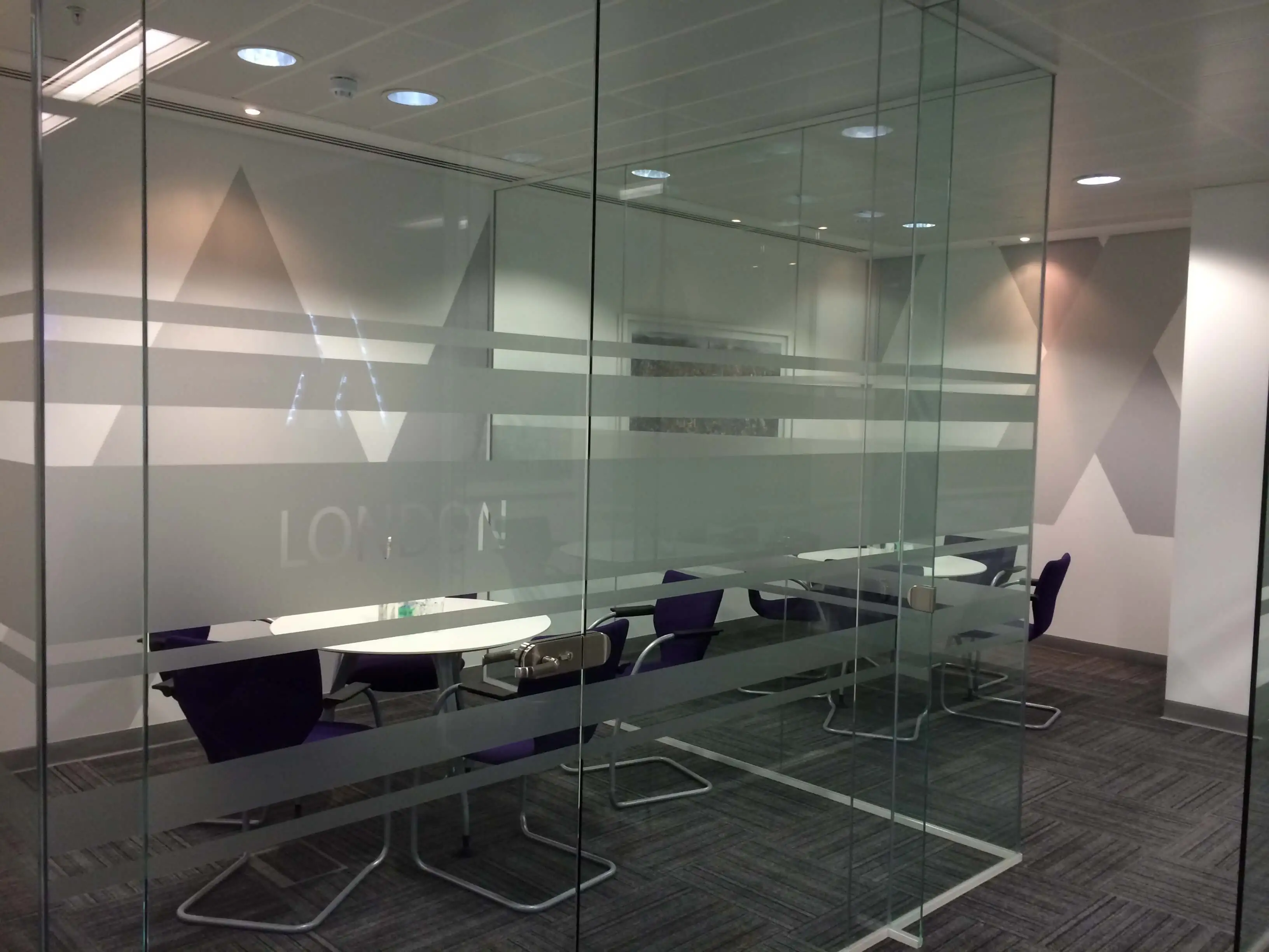 Two small meeting space with glass partitions