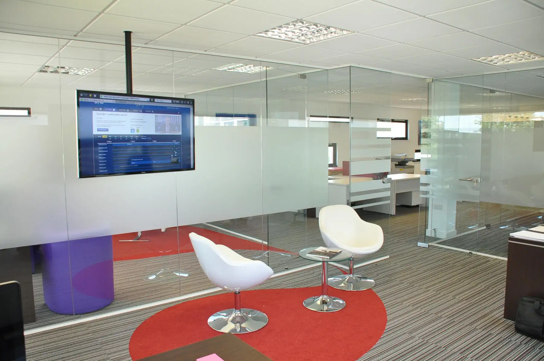 Unimines Office space with frameless glass partitions