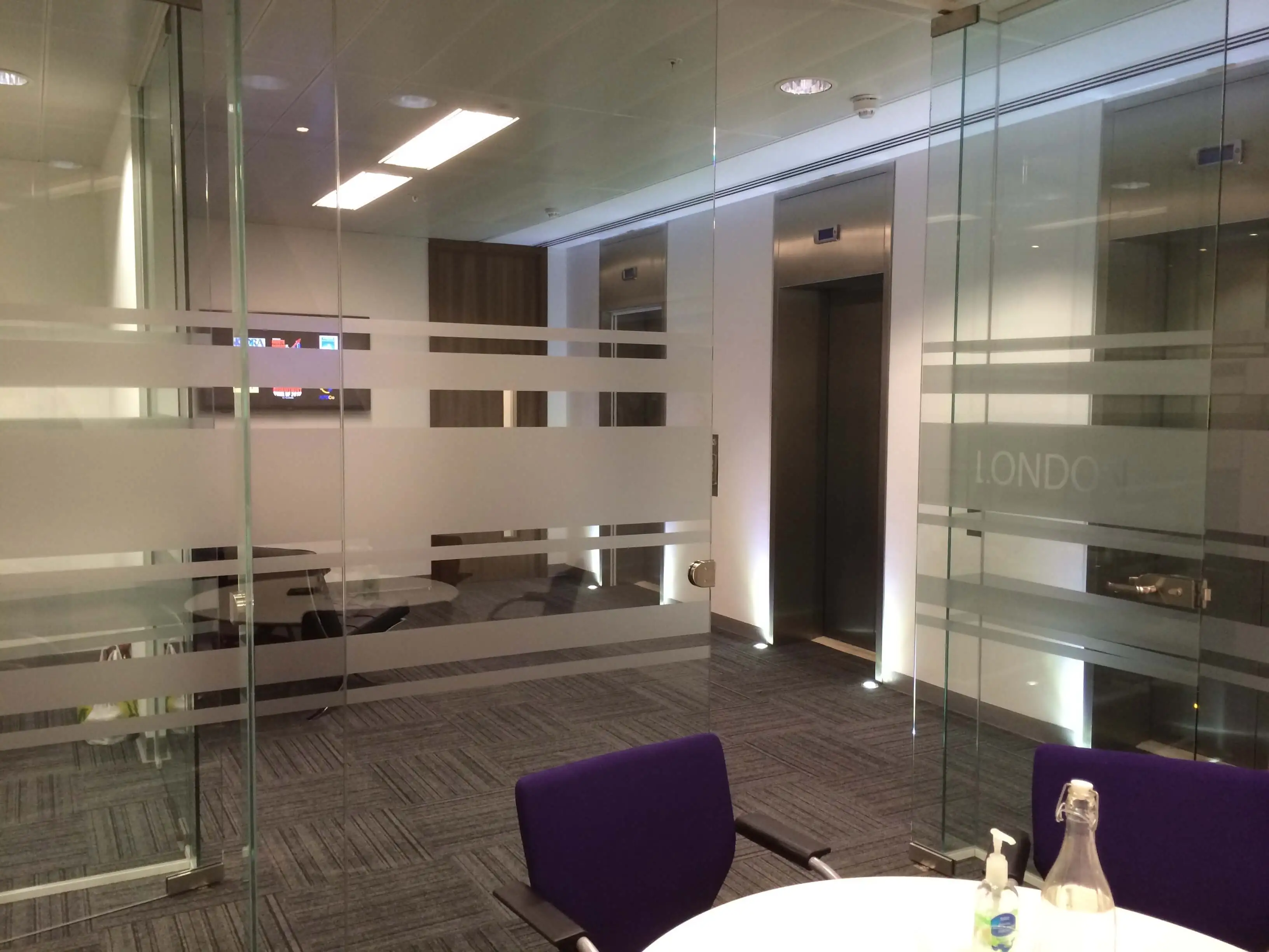 Waiting area and meeting room space with glass partitions