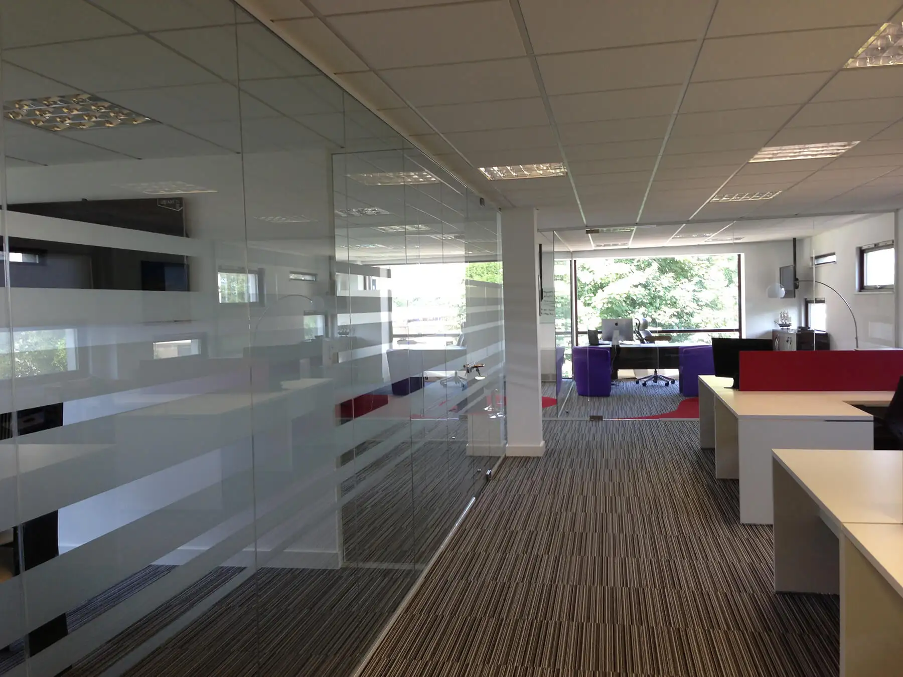 Workspace with designer flooring and glass partitions