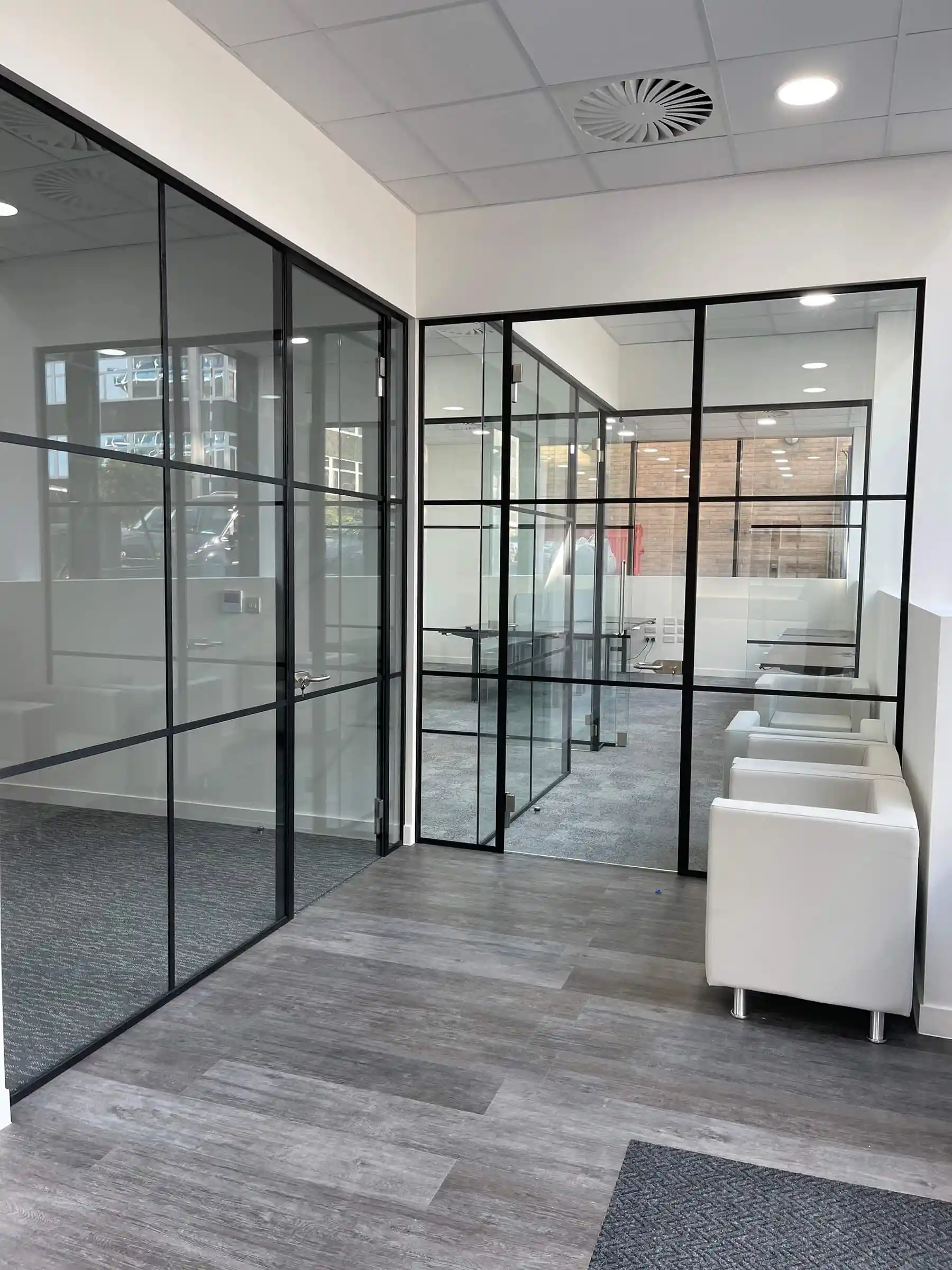 Breakout area with black framed glass partitions_