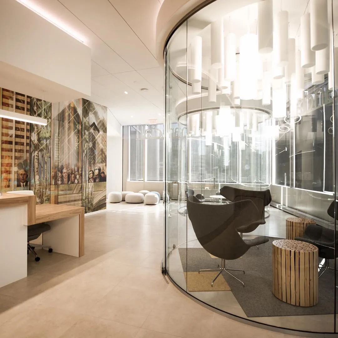 Breakout space with curved glass partitions