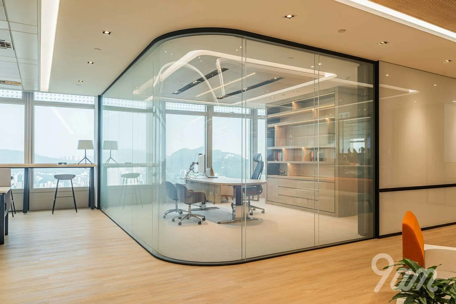 Curved glass partitions in office for executive space