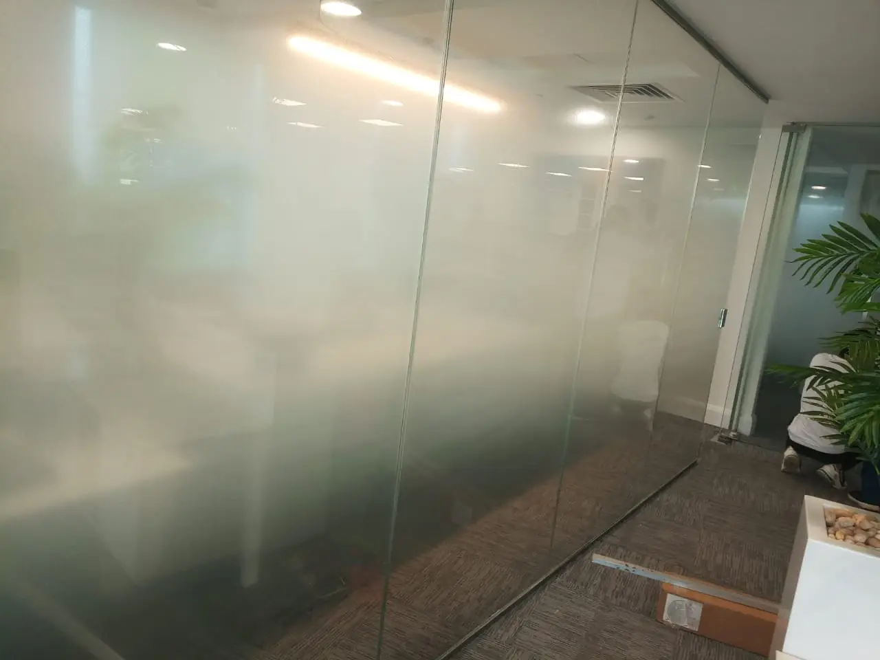 Faceted glass doors in office