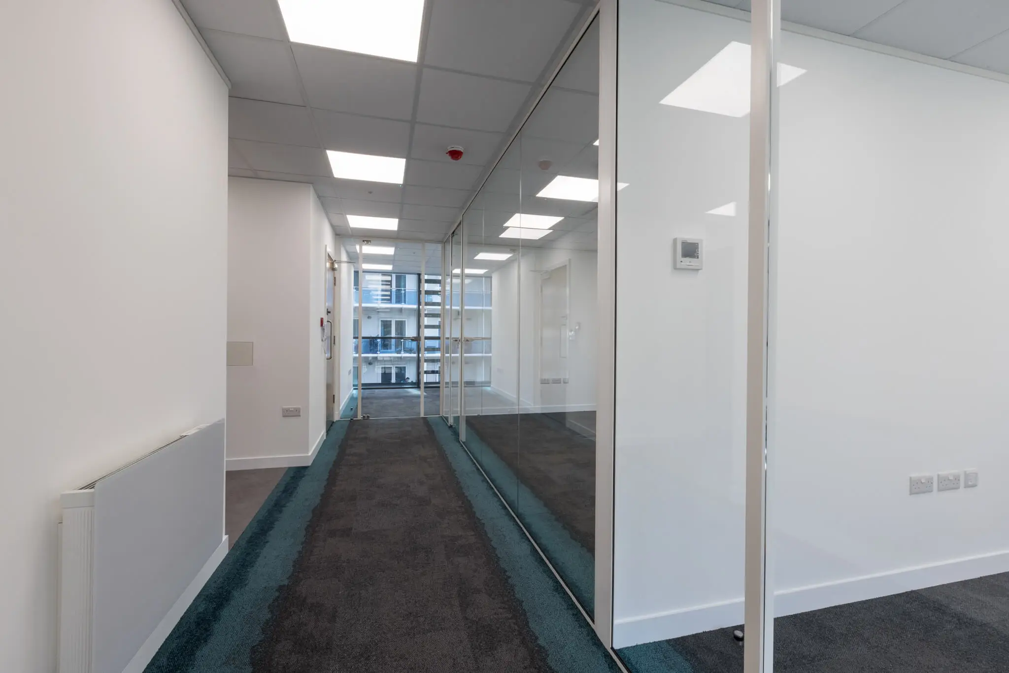 Large office space divided with glass walls