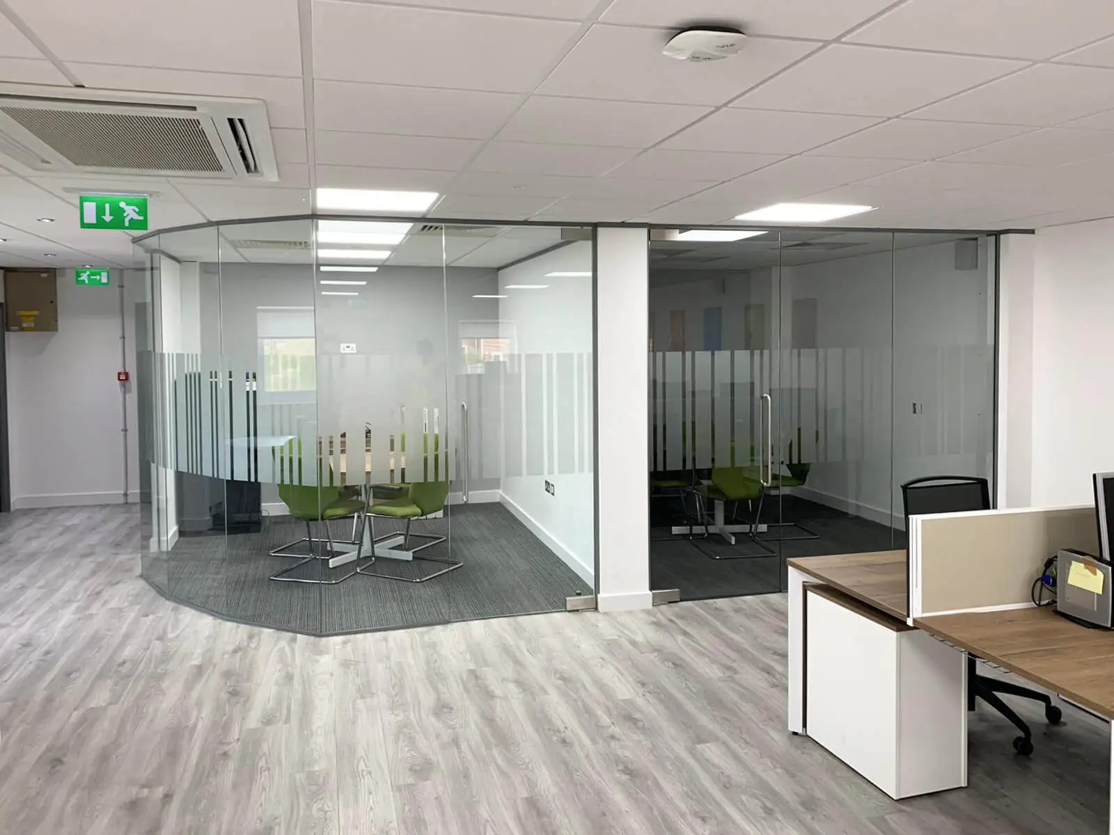 Meeting rooms speparated with glass walls and with designer floor