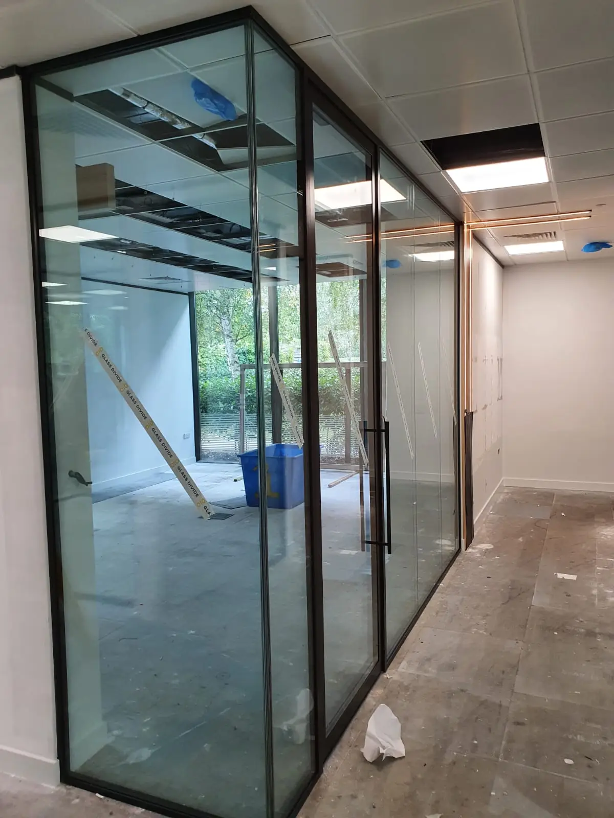 Office partitions with black framed double glazed with double glazes doors