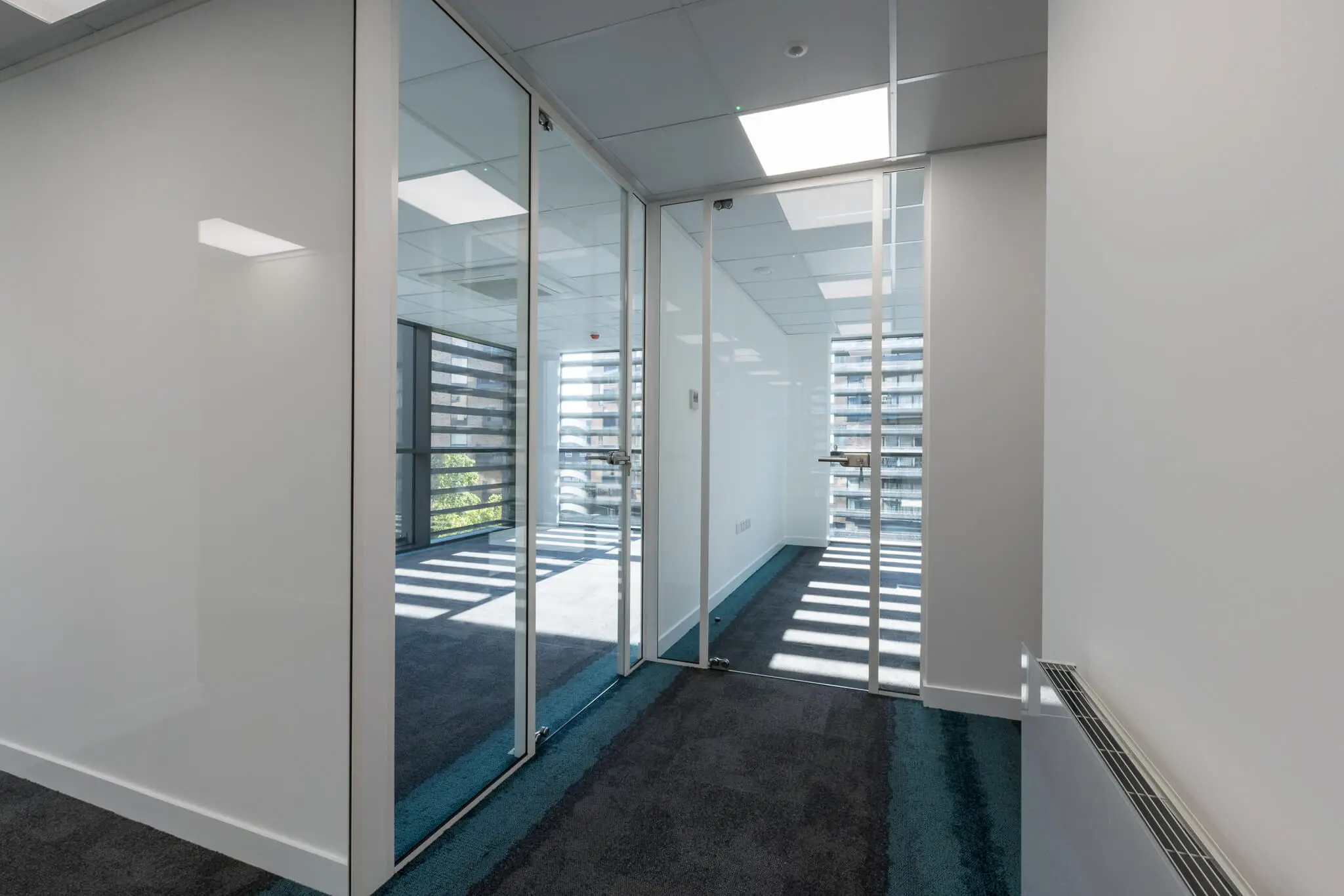 Office rooms divided with glass walls