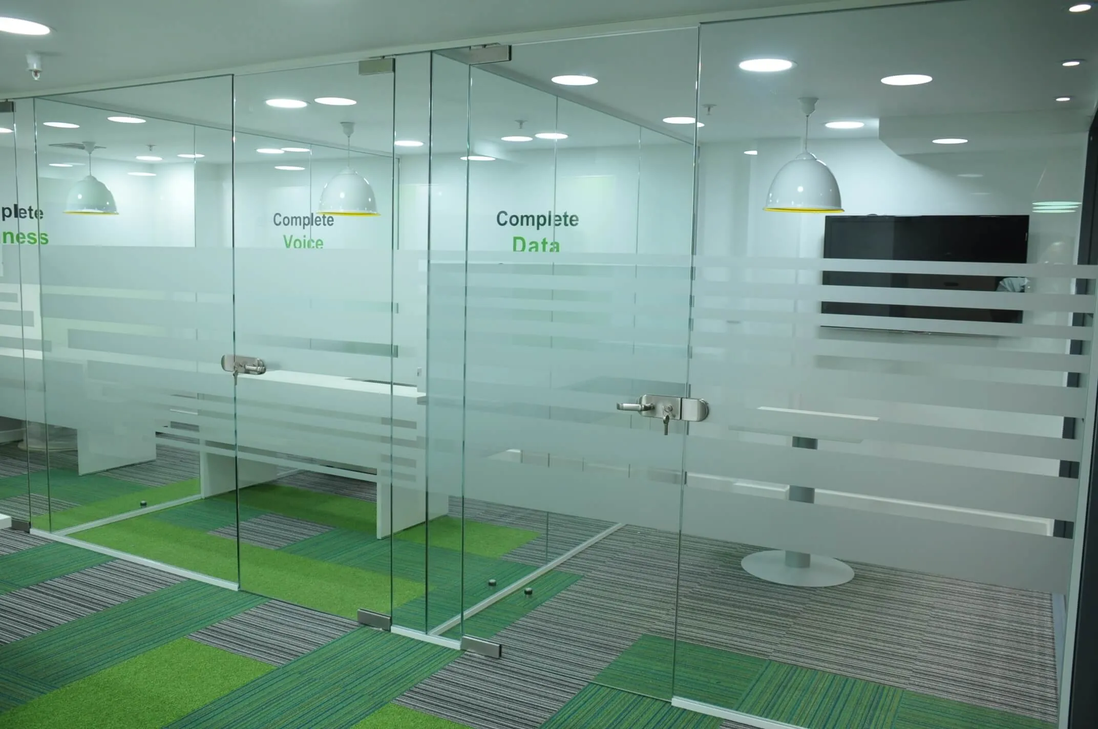 Office spaces with frameless glass doors
