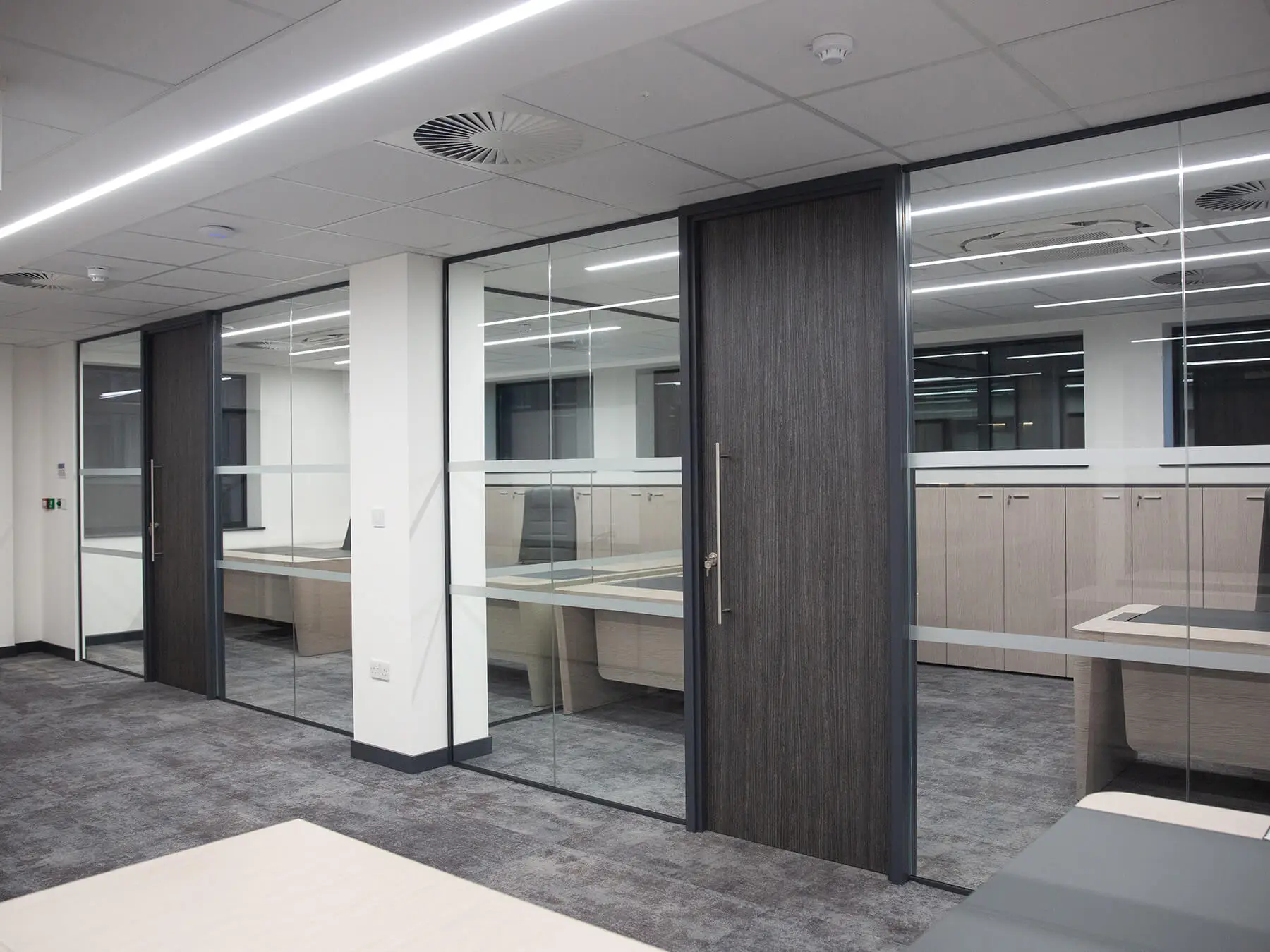 Office with single glaze partitions with solid doors