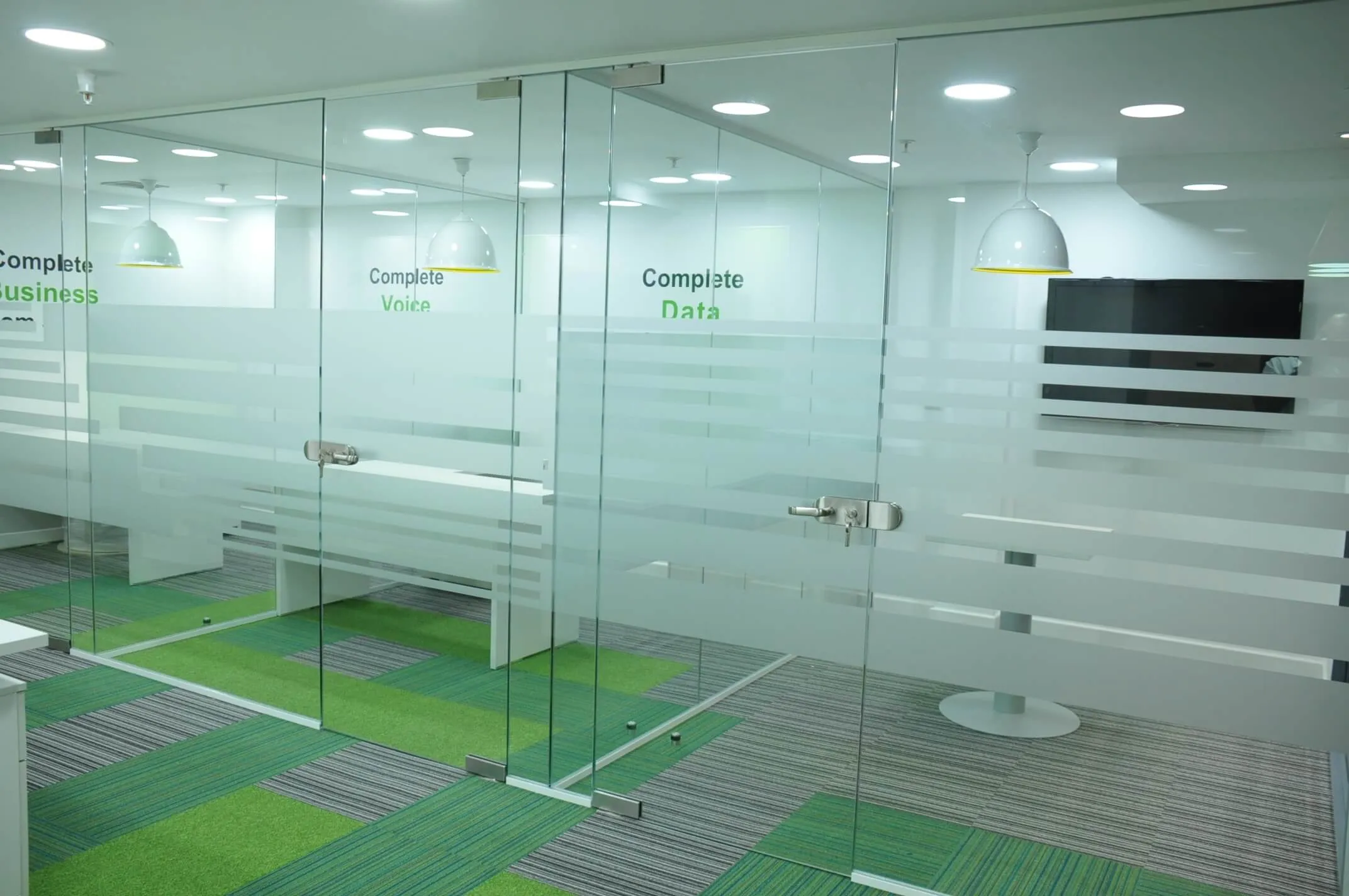 Private work spaces with glass partitons and frameless glass doors