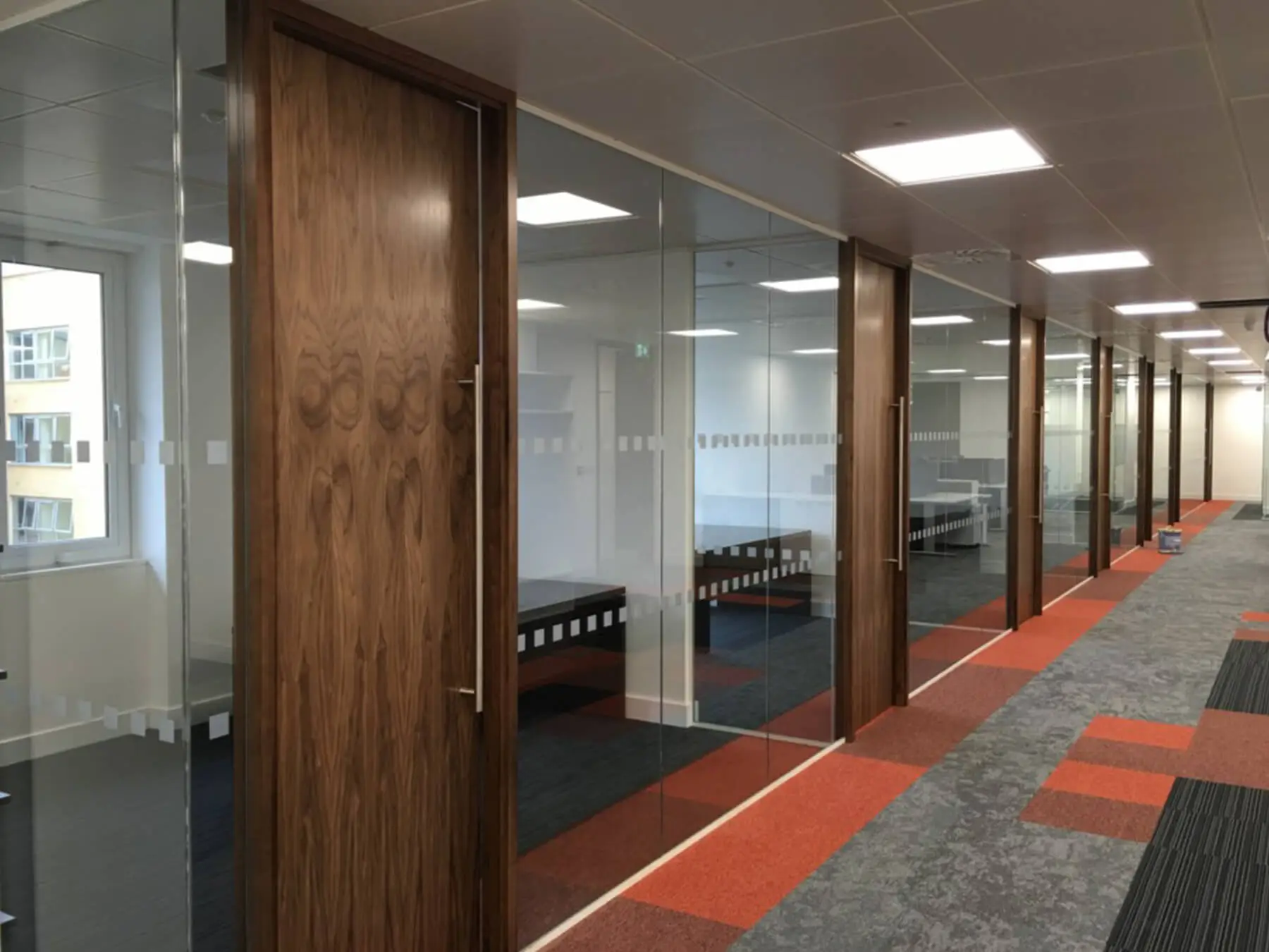 Single glaze partitions with solid doors with full height handles